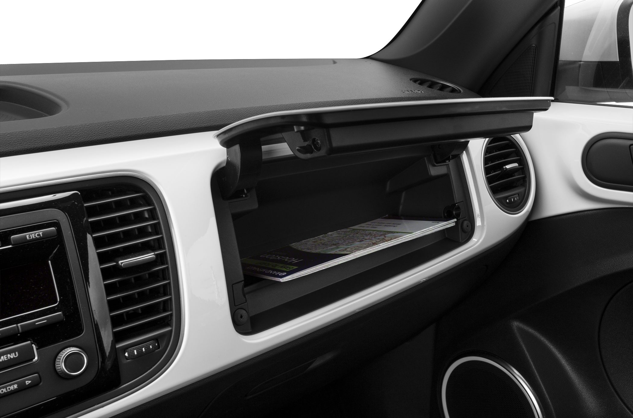 Open glove compartment in a car interior with map inside