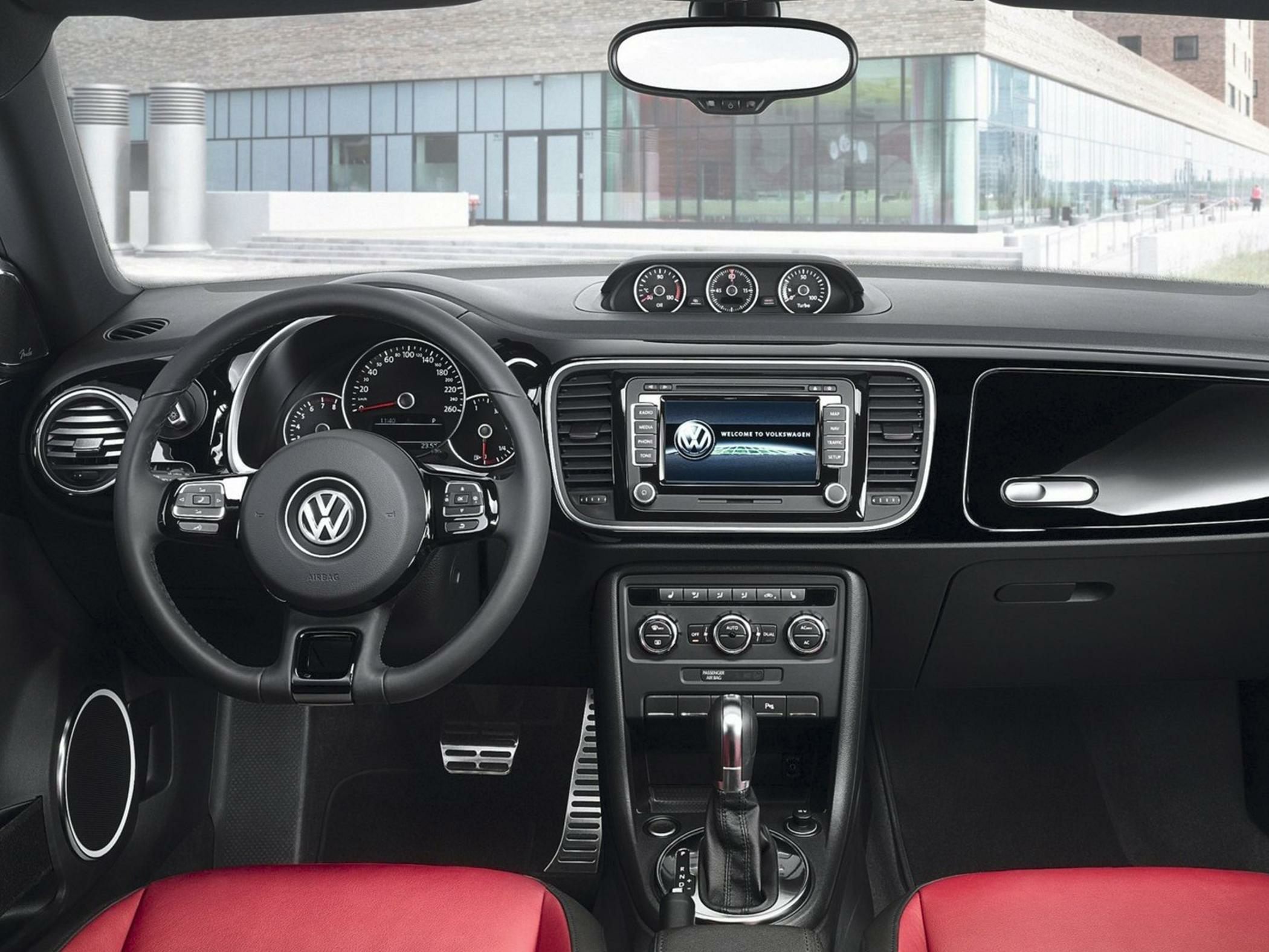 Dashboard with digital display, steering wheel, instrument cluster, and gear shifter