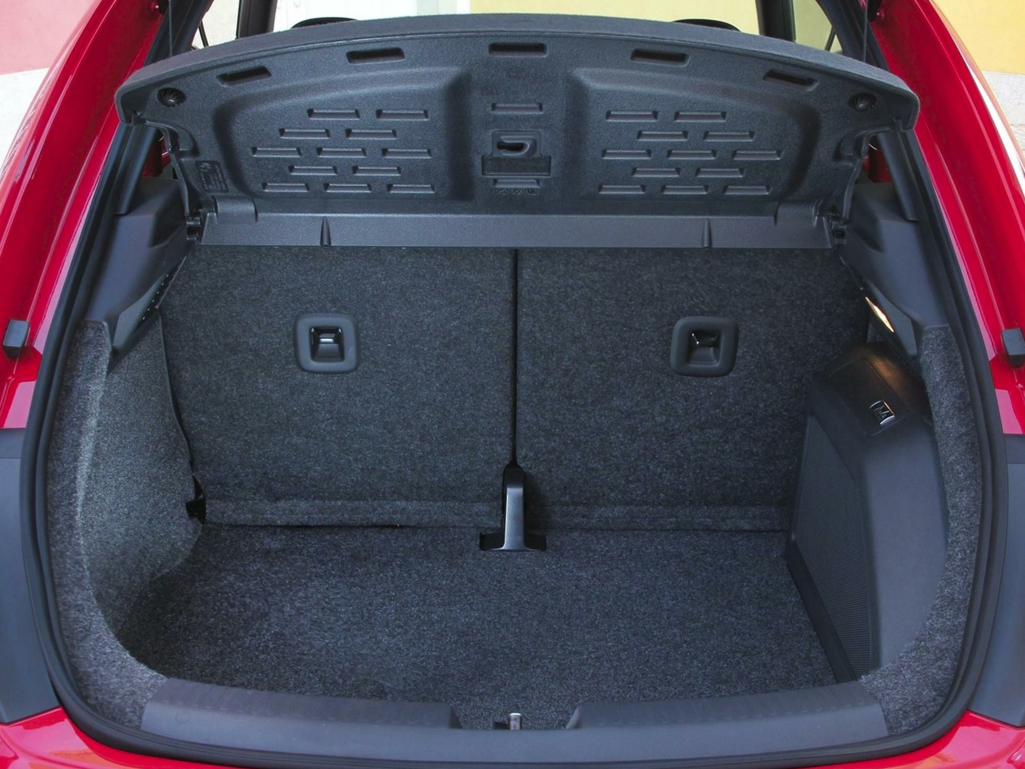 Spacious trunk area with foldable rear seatbacks and carpet lining