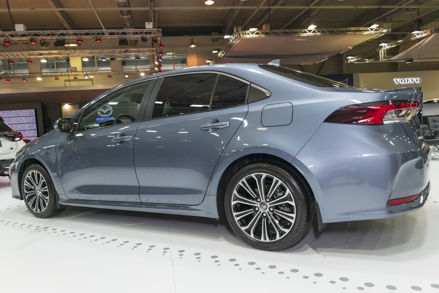 Rear side profile with alloy wheels and sleek sedan styling