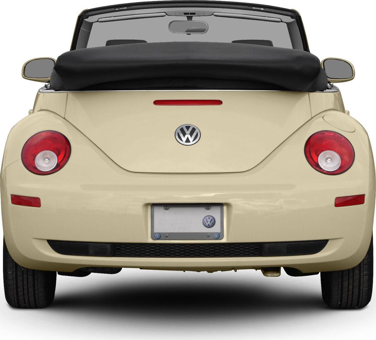 Rear view of convertible with rounded tail lights and folded soft top.