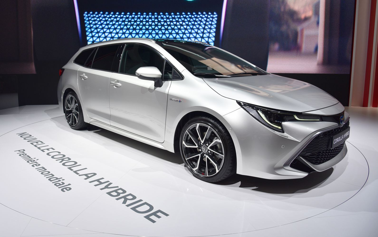 Front-side view with sleek headlights and sporty alloy wheels