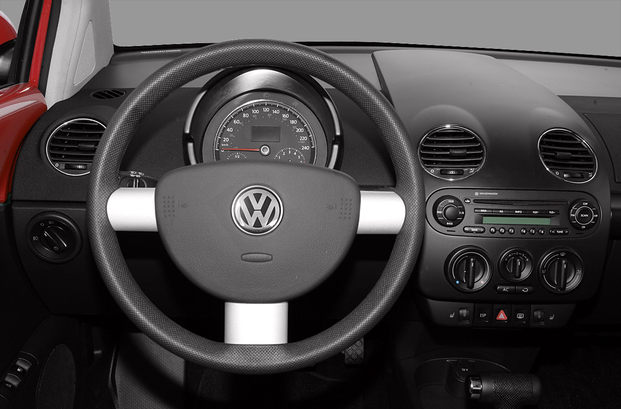 Steering wheel and dashboard with speedometer and climate controls