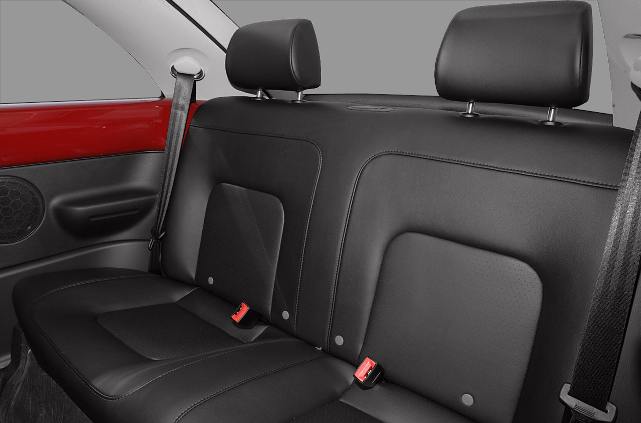 Black leather rear seats with headrests and seatbelt setup