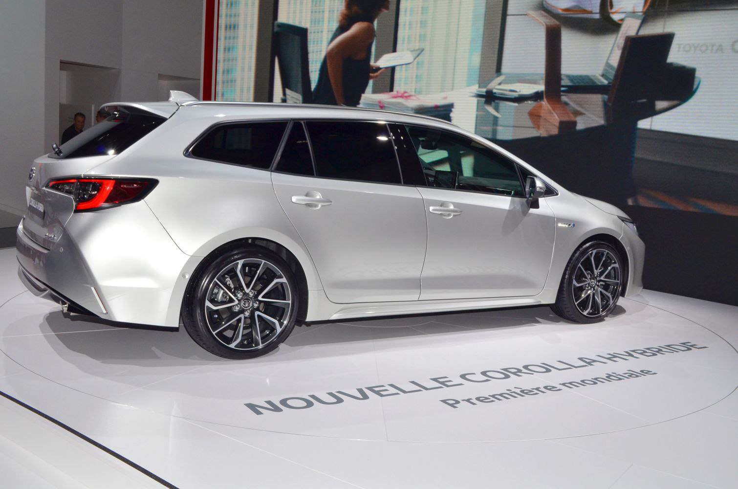 Silver hybrid estate car with sporty alloy wheels and rear spoiler
