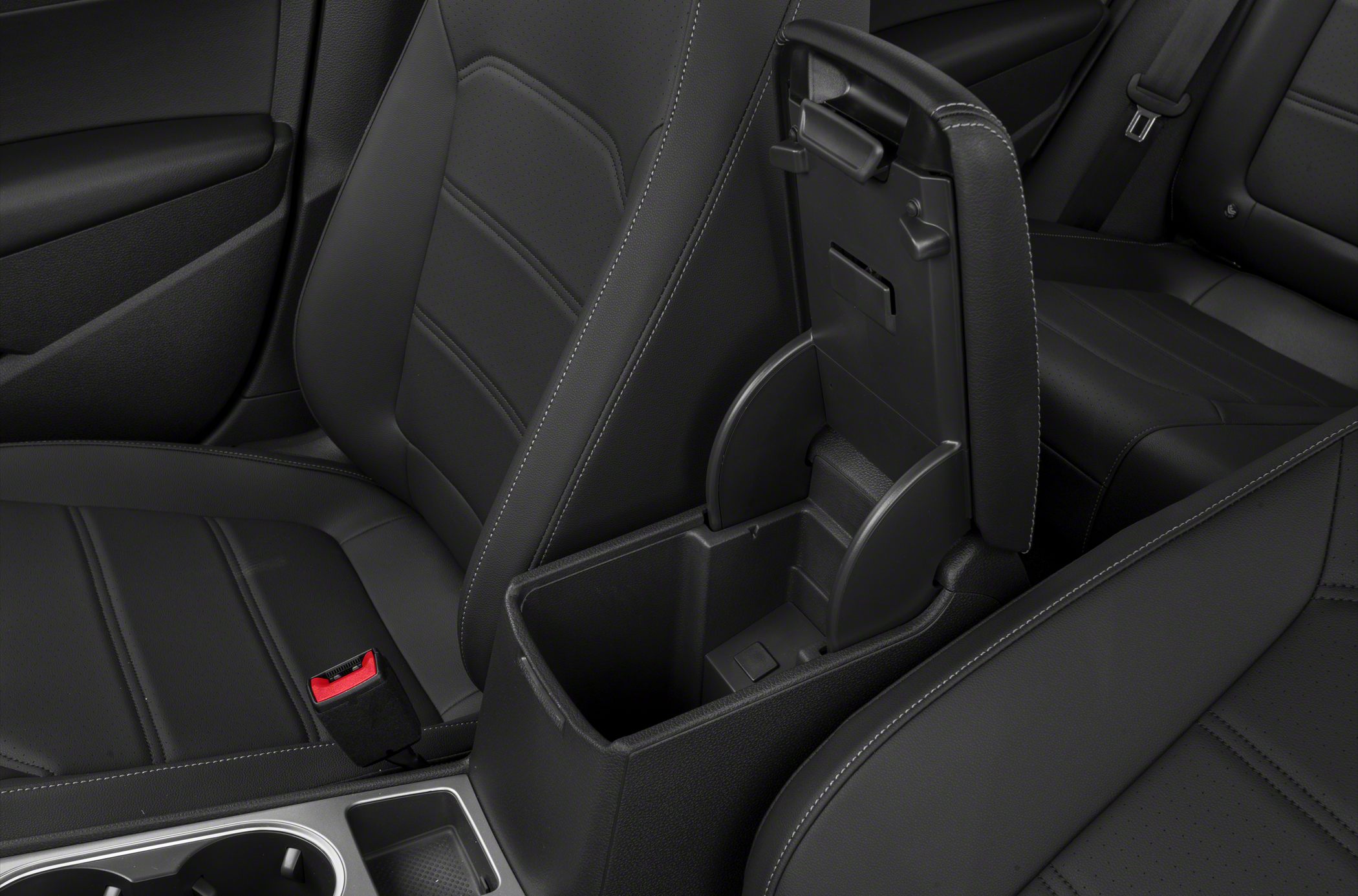 Black car seats and open center console storage compartment