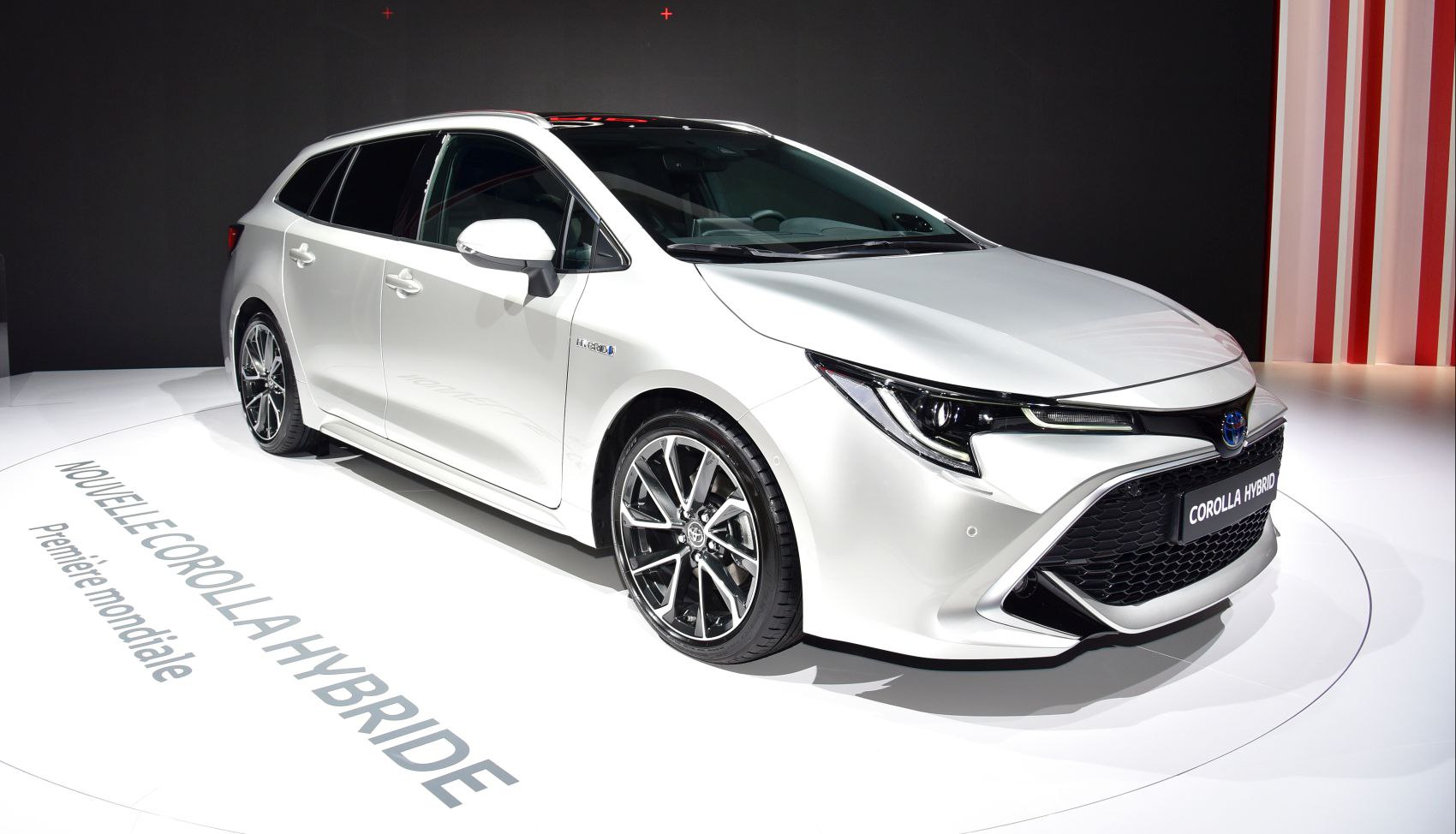 Sleek front end and modern alloy wheels of a hybrid wagon