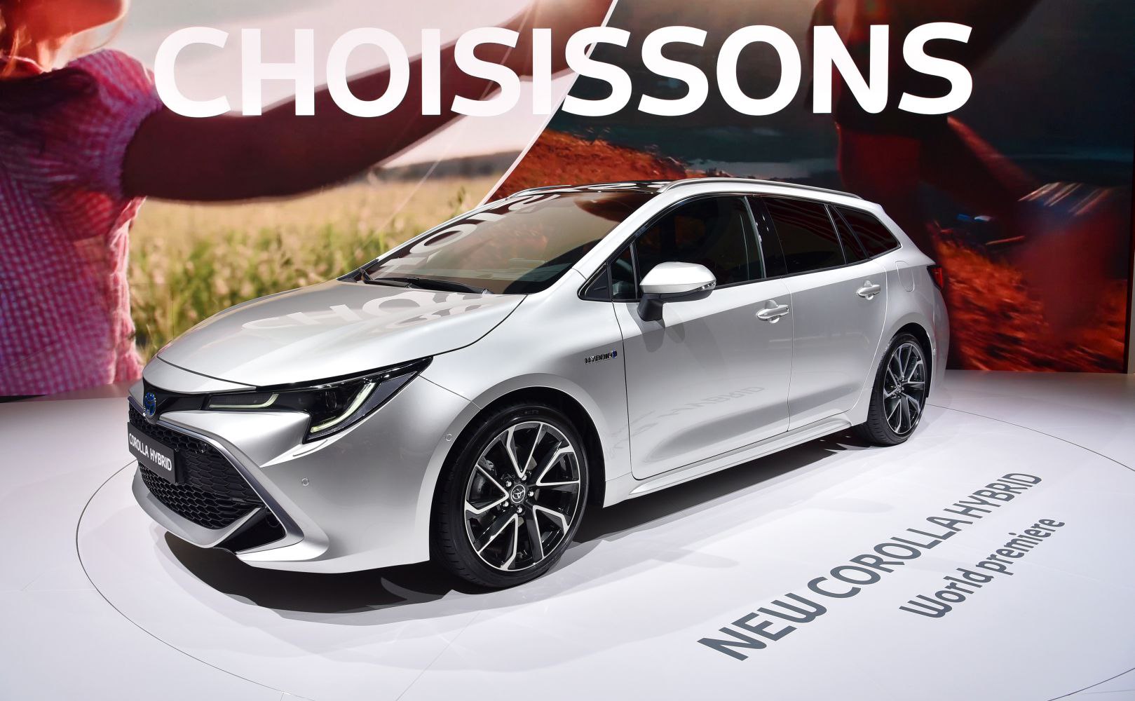 Silver hybrid station wagon with sporty alloy wheels and aerodynamic design