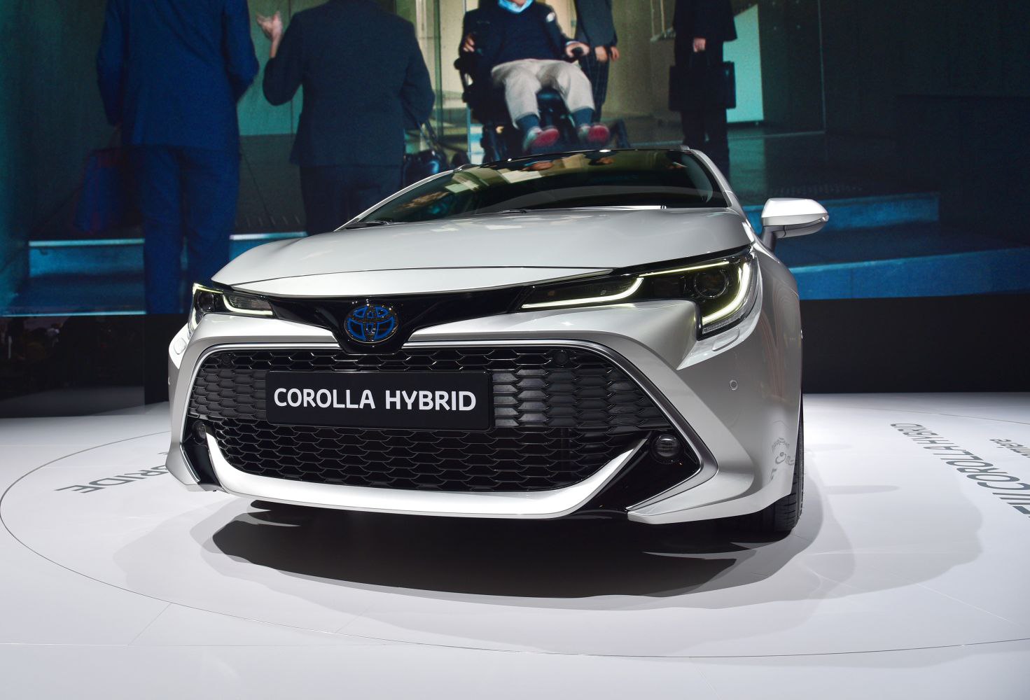 Front view with LED headlights and large black grille