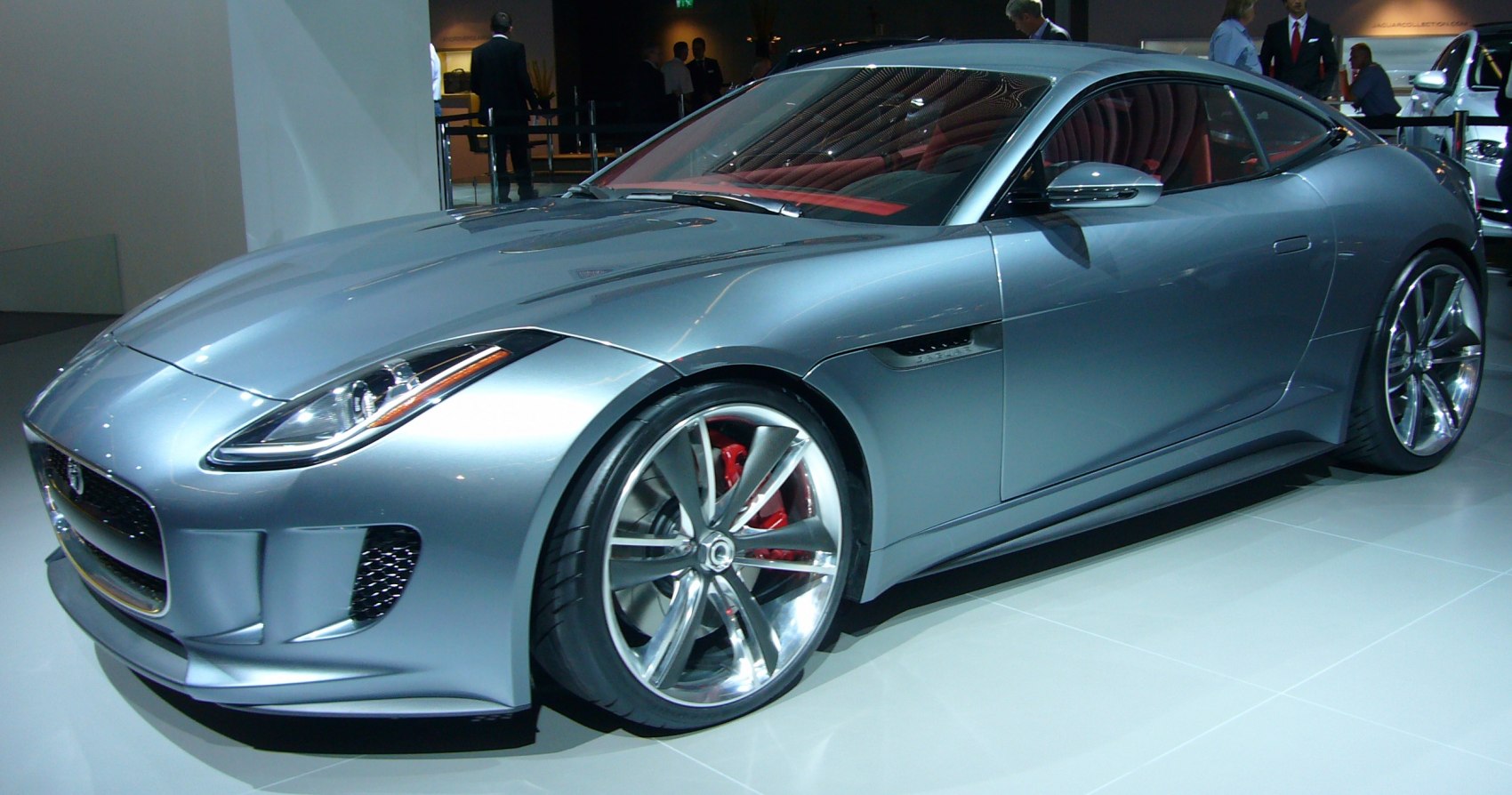 Sleek aerodynamic sports coupe with distinctive alloy wheels and red brake calipers
