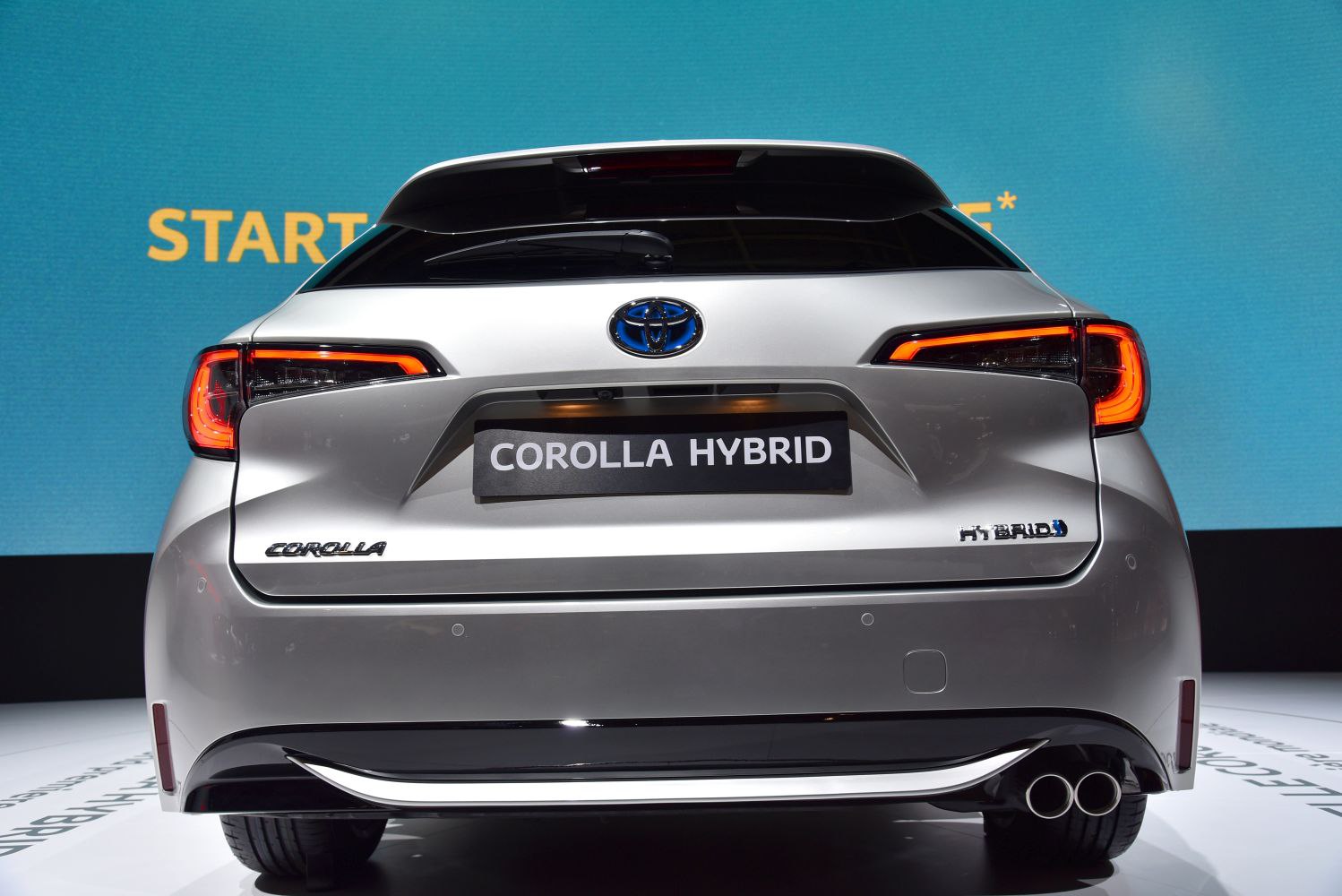 Rear view of hybrid wagon with distinctive taillights and dual exhaust