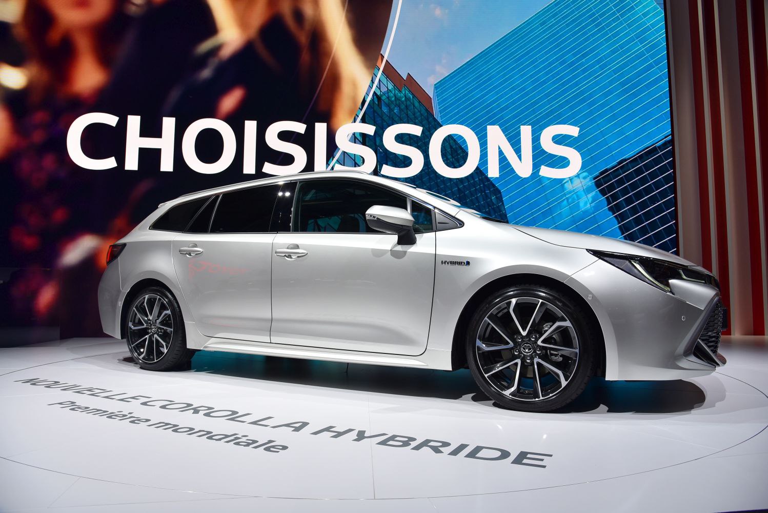 Silver hybrid station wagon with sleek side profile and alloy wheels