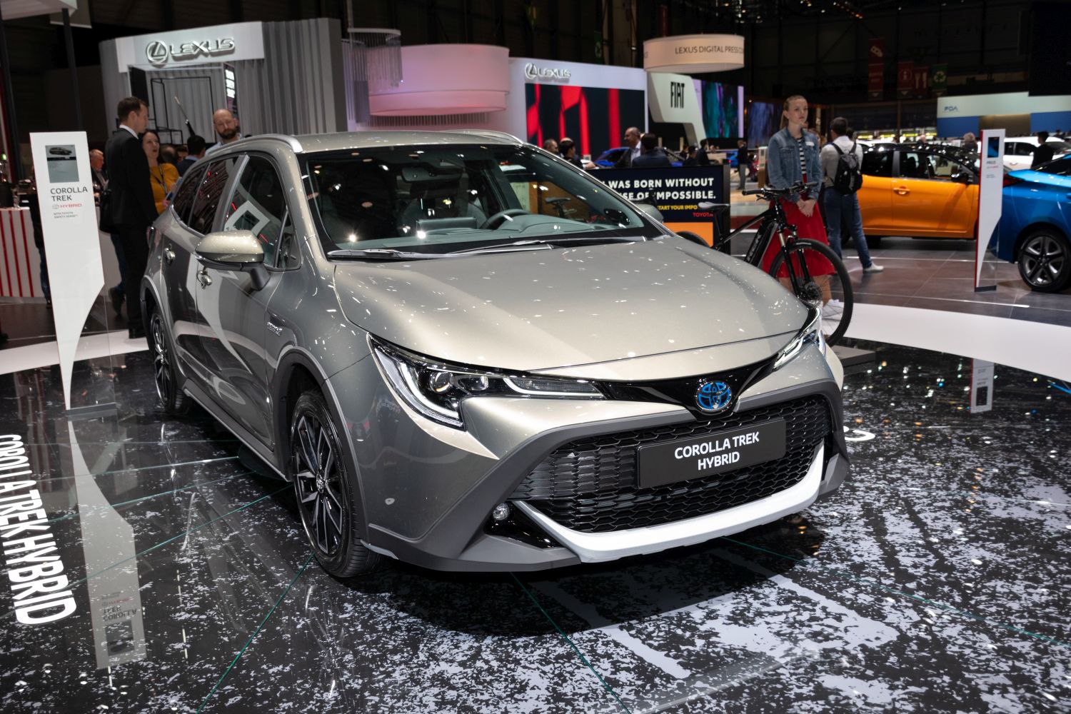 Front view of hybrid hatchback with sleek headlights and black grille