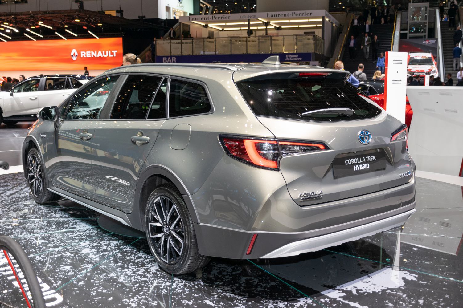 Hybrid station wagon rear with distinct tail lights and alloy wheels