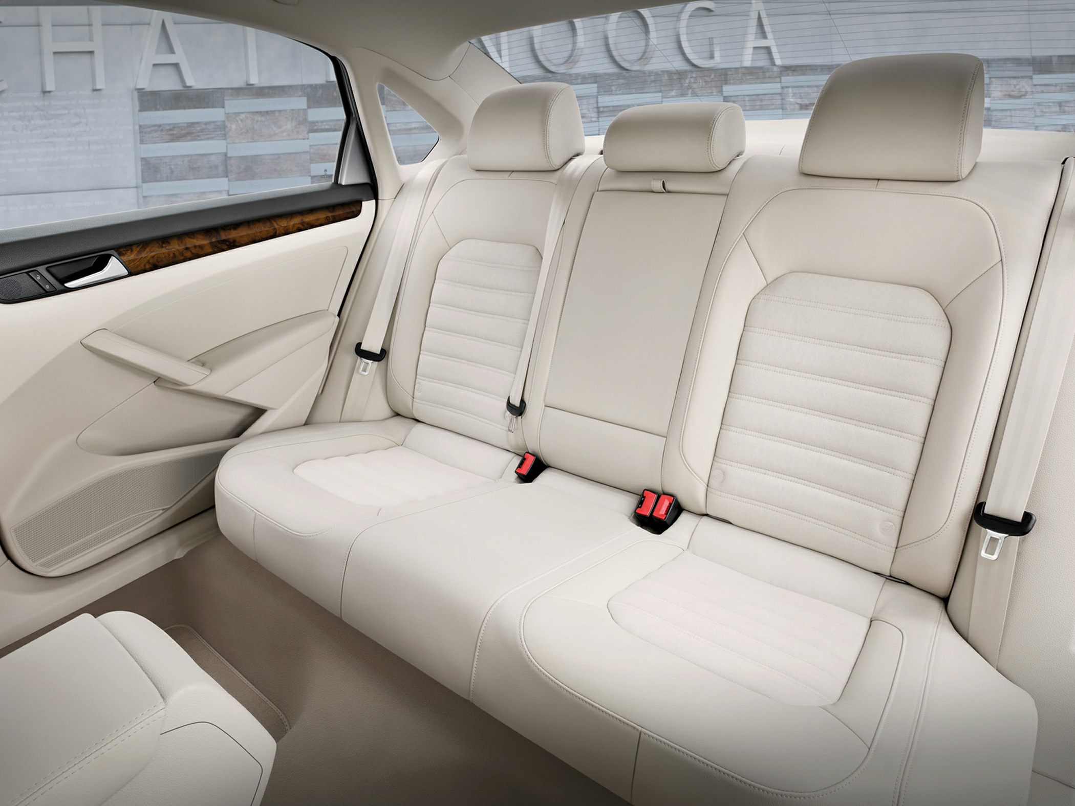 Cream leather rear seats with wood trim accents