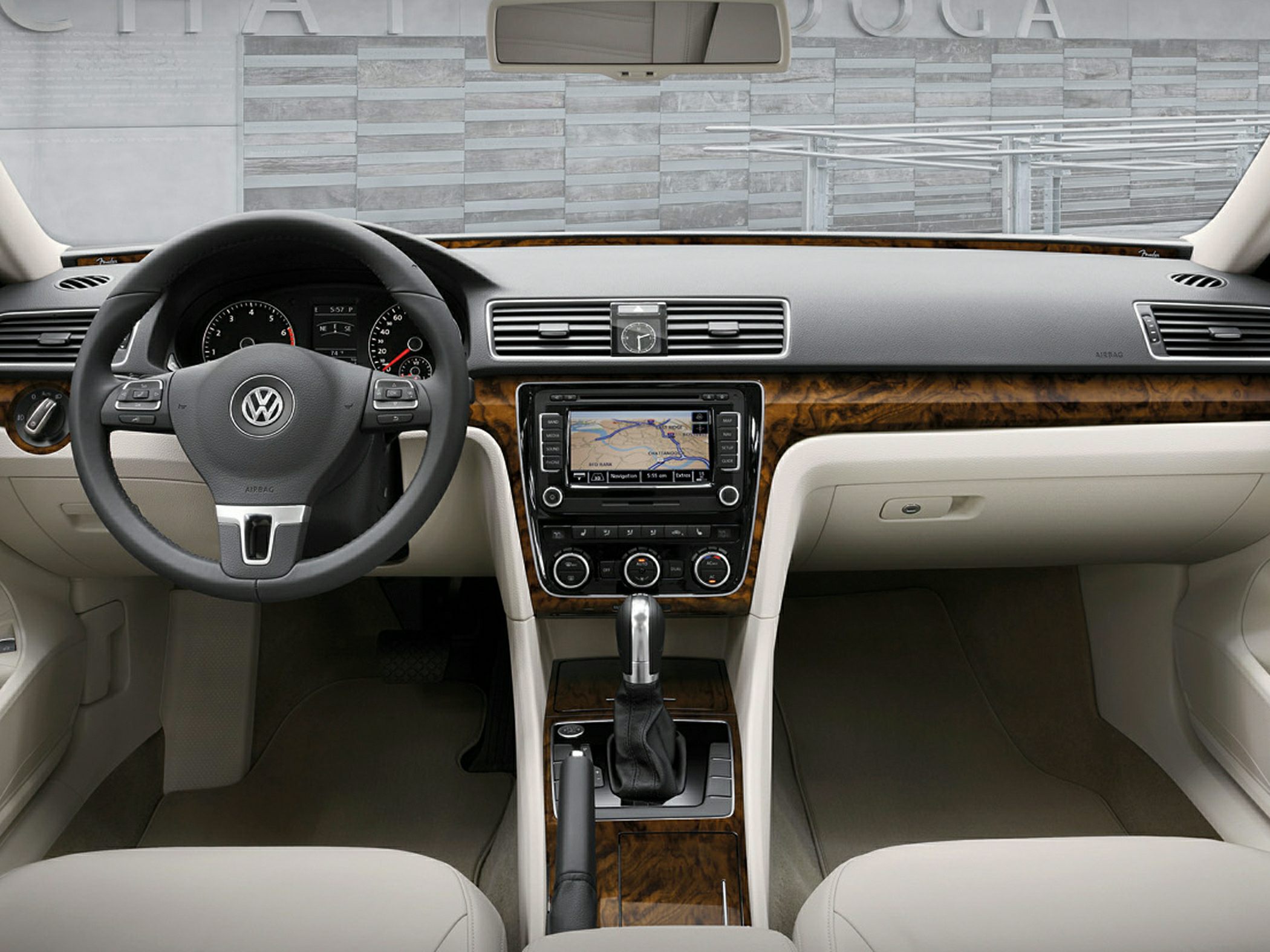 Steering wheel, wood trim dashboard, integrated navigation, automatic gear shift