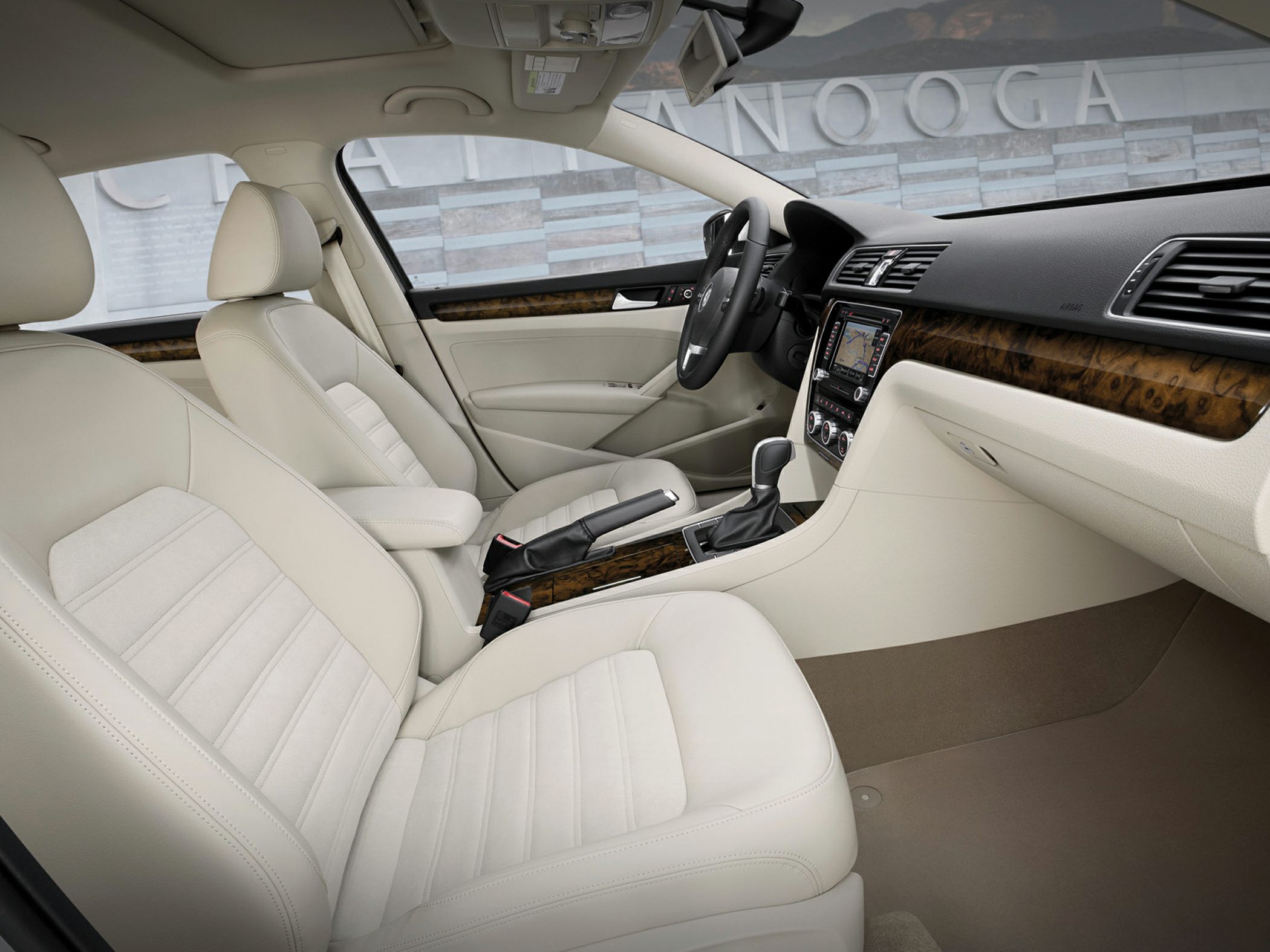 Beige leather seats and wood trim dashboard interior