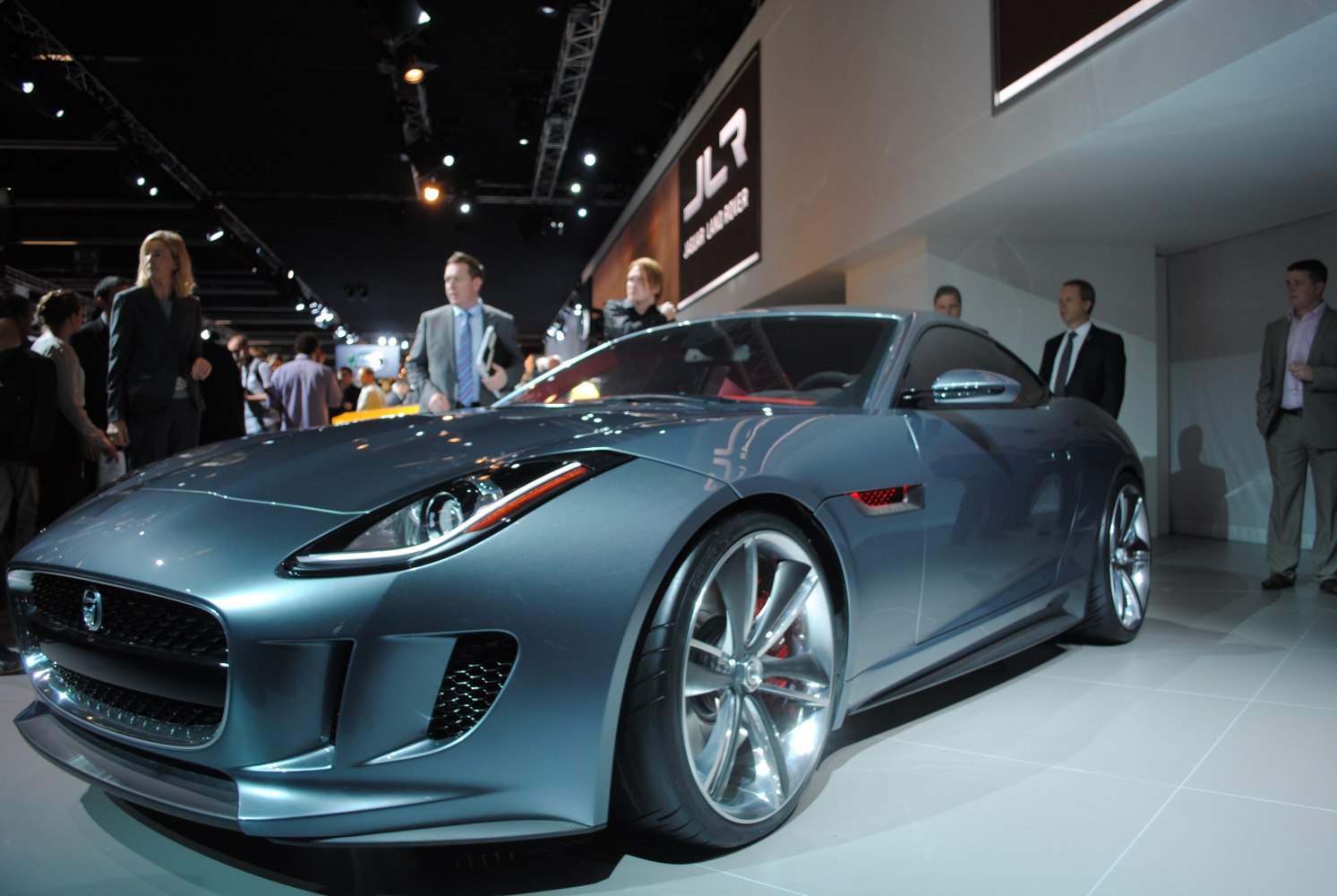 Sleek blue sports coupe with aerodynamic body and stylish alloy wheels