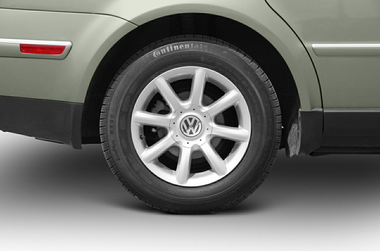 Alloy wheel with Continental tire on car, rim design visible