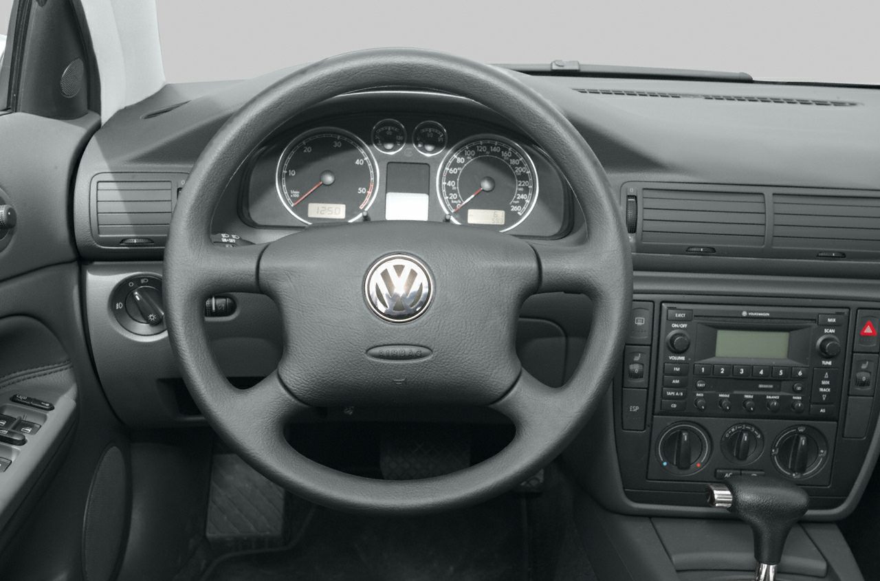 Steering wheel with Volkswagen logo and dashboard instruments