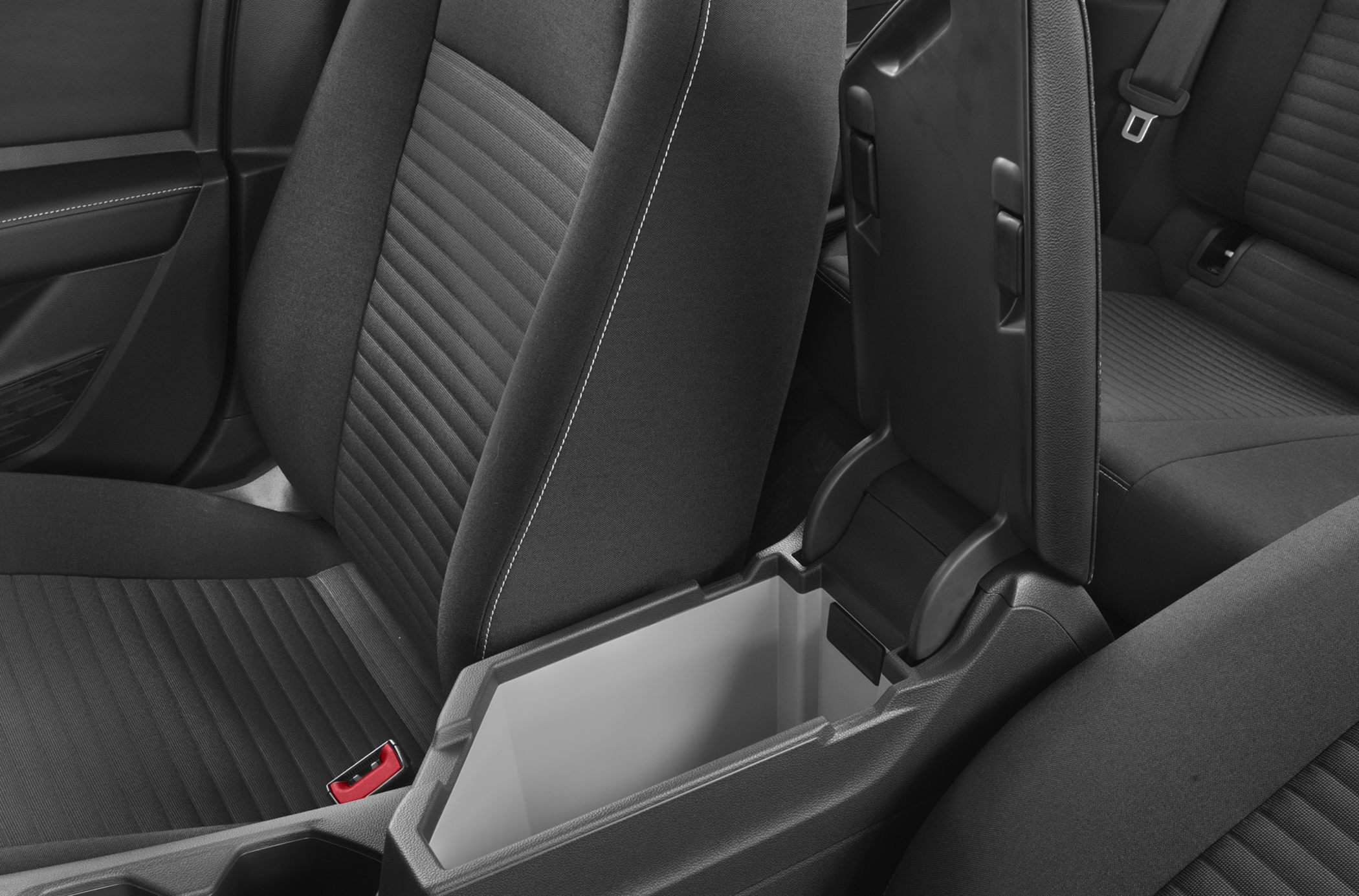 Fabric seats with detailed stitching and spacious center console storage