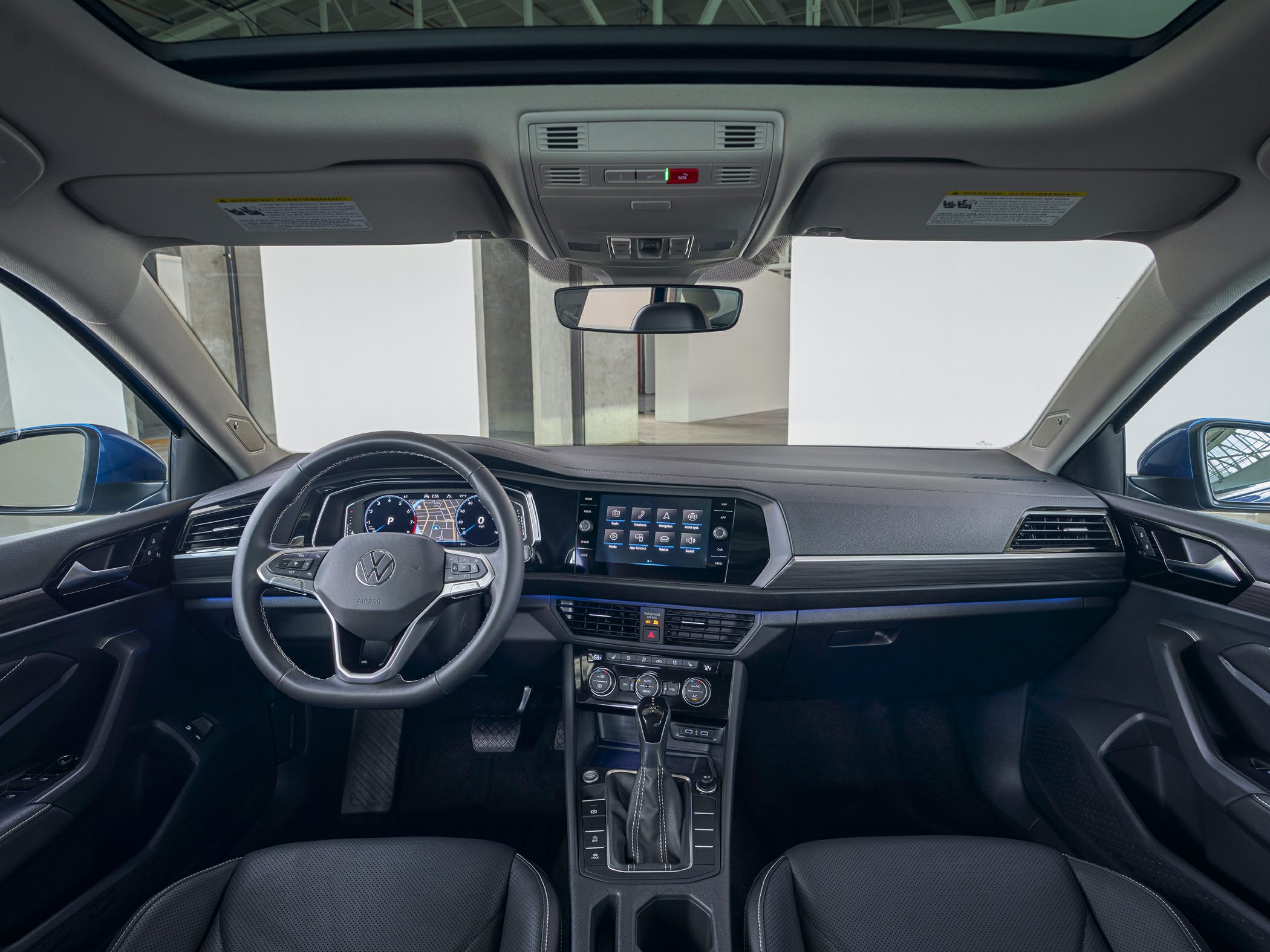 Digital dashboard, touchscreen infotainment, steering wheel, gear shift