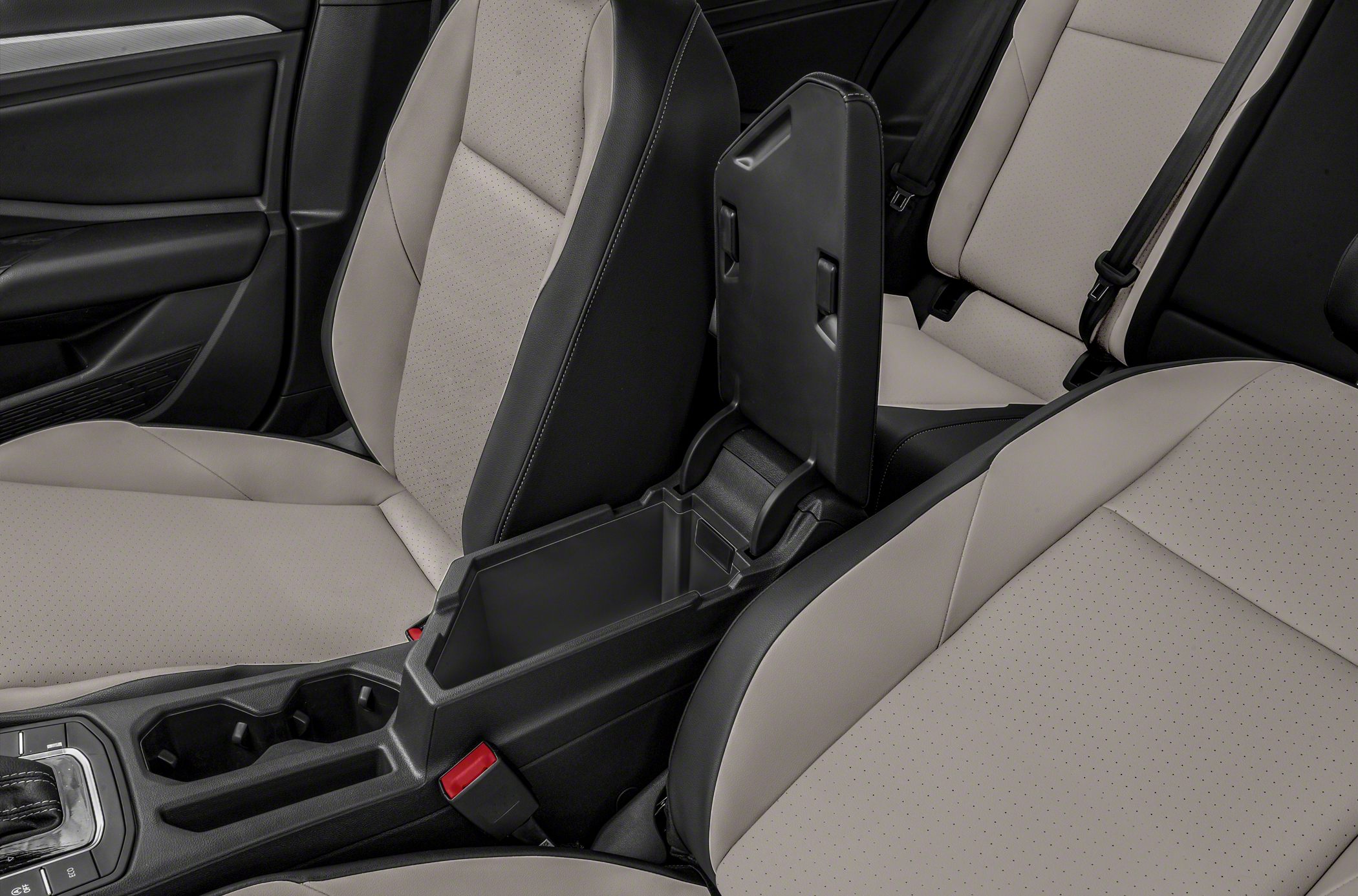 Perforated seats and open center console storage with dual cup holders