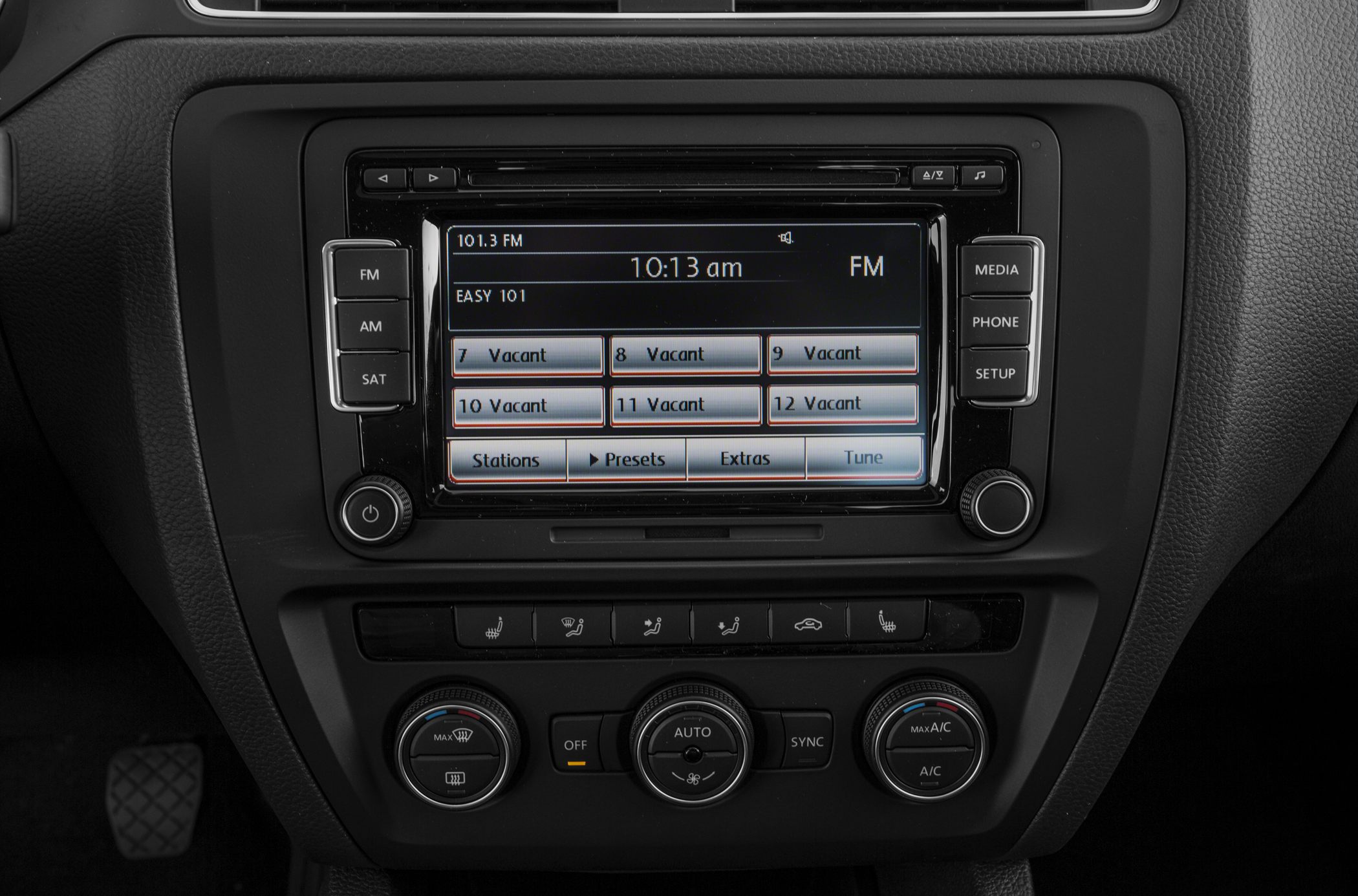 Car infotainment and climate control interface with radio and media buttons