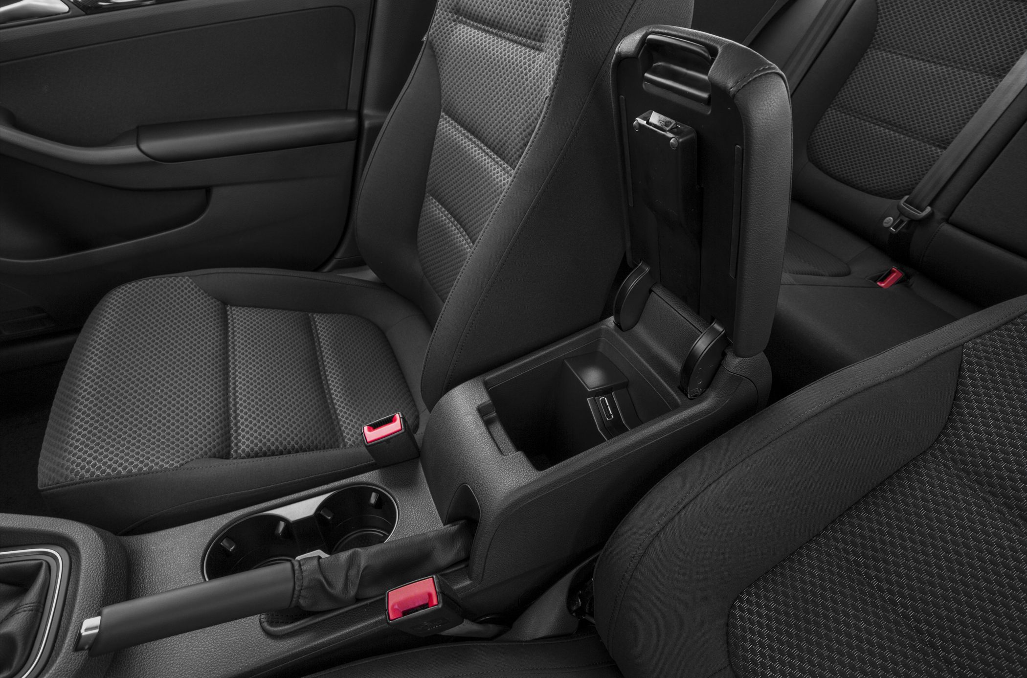 Center console storage, fabric car seats, handbrake, cup holders