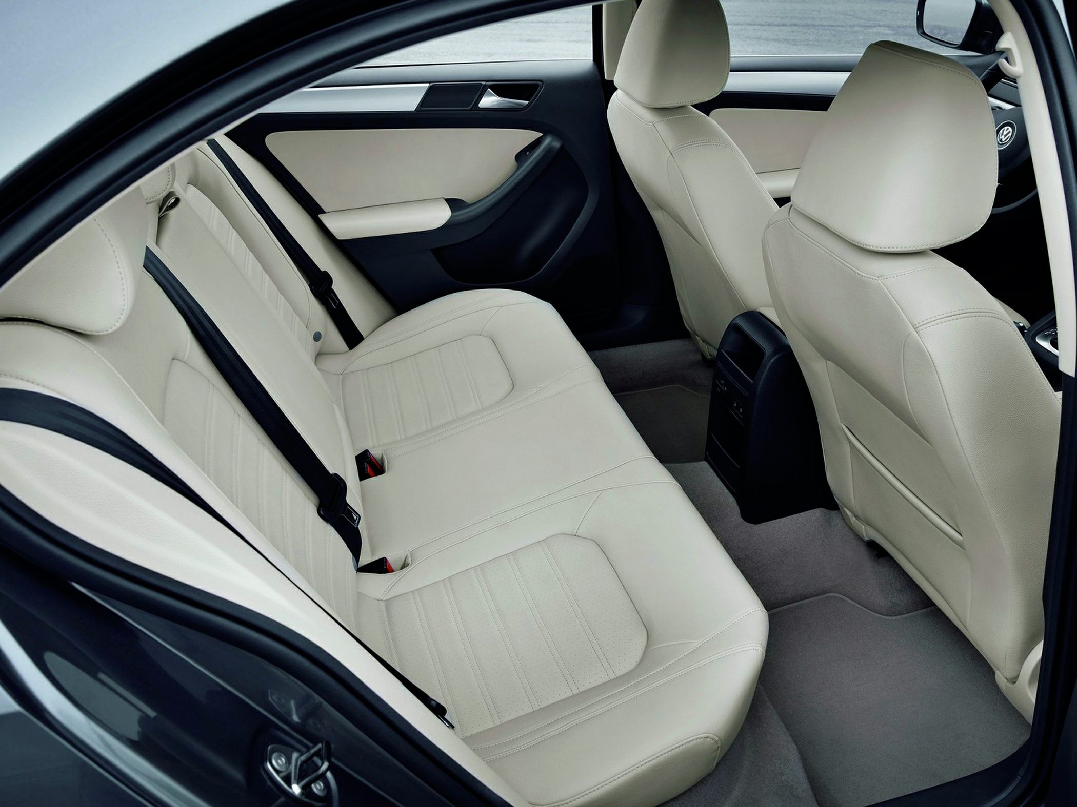 Beige leather rear seats and spacious back interior with black trim