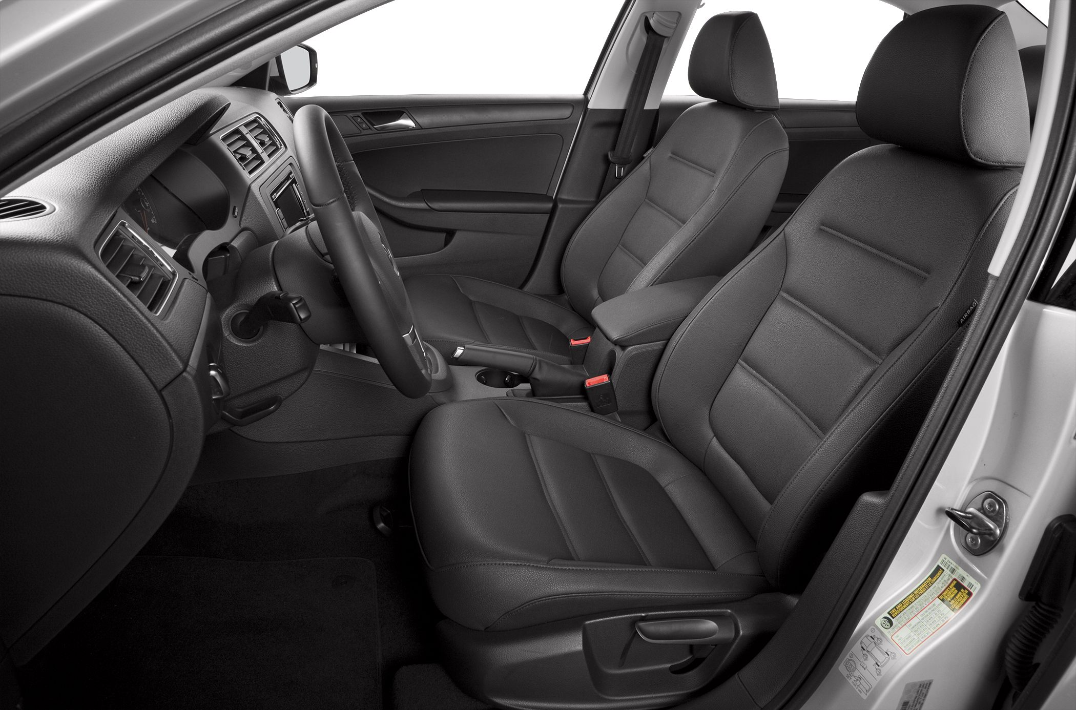 Front seats, dashboard, and steering wheel interior view