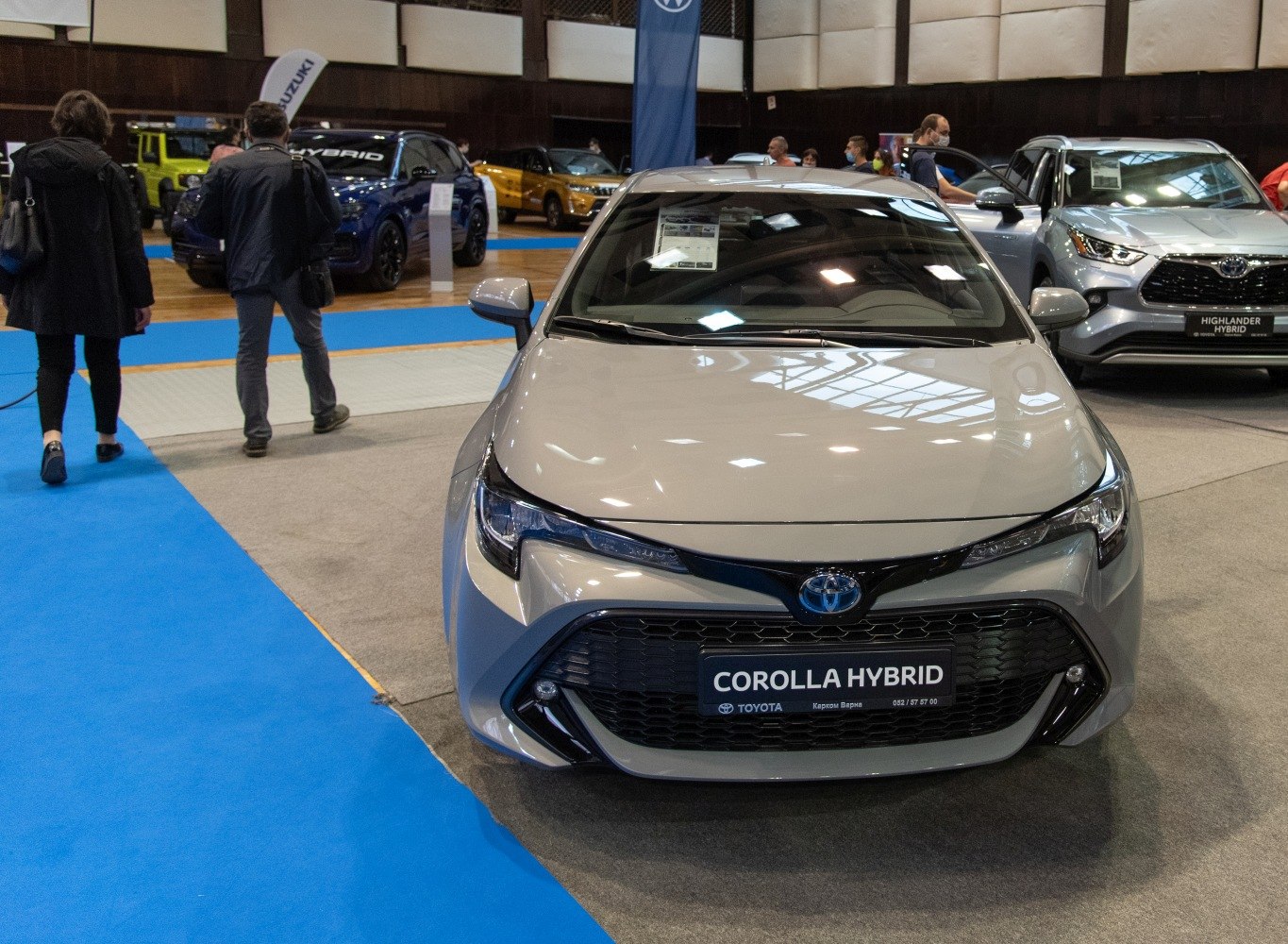 Front view of a sleek hybrid car with aerodynamic lines and LED headlights