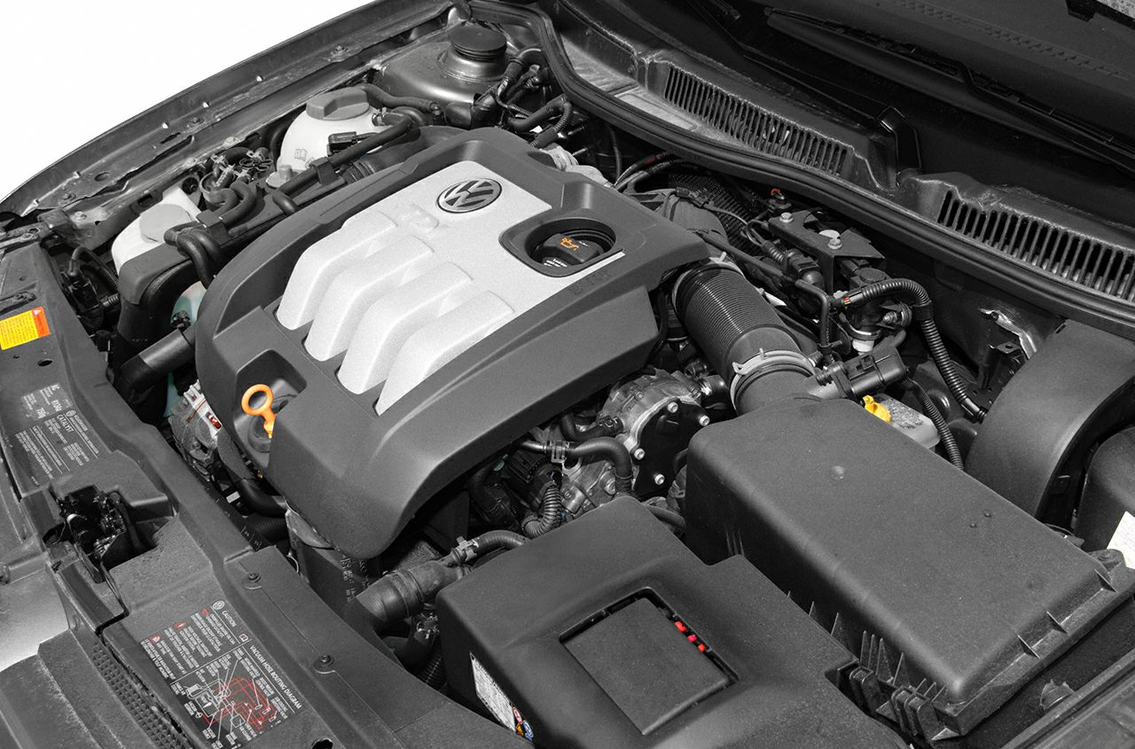 Engine bay with VW emblem cover and air intake system