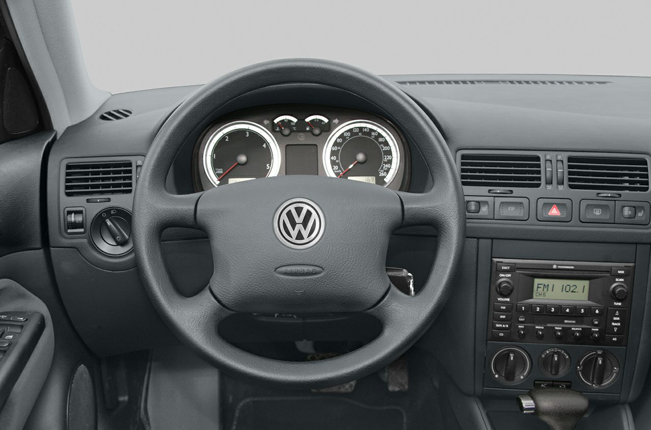 Dashboard with analog gauges and central stereo system