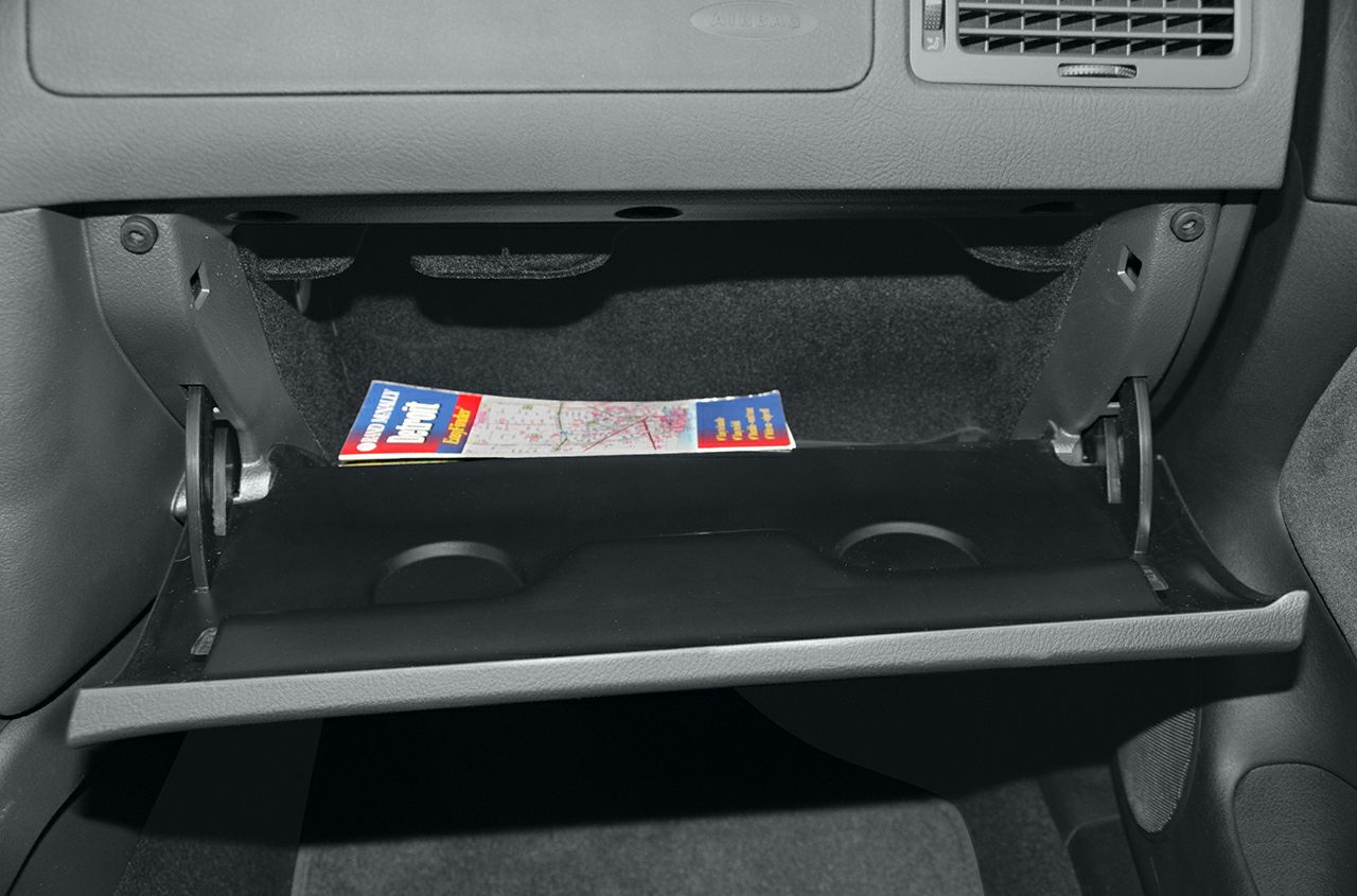 Open glove compartment with internal storage and map inside