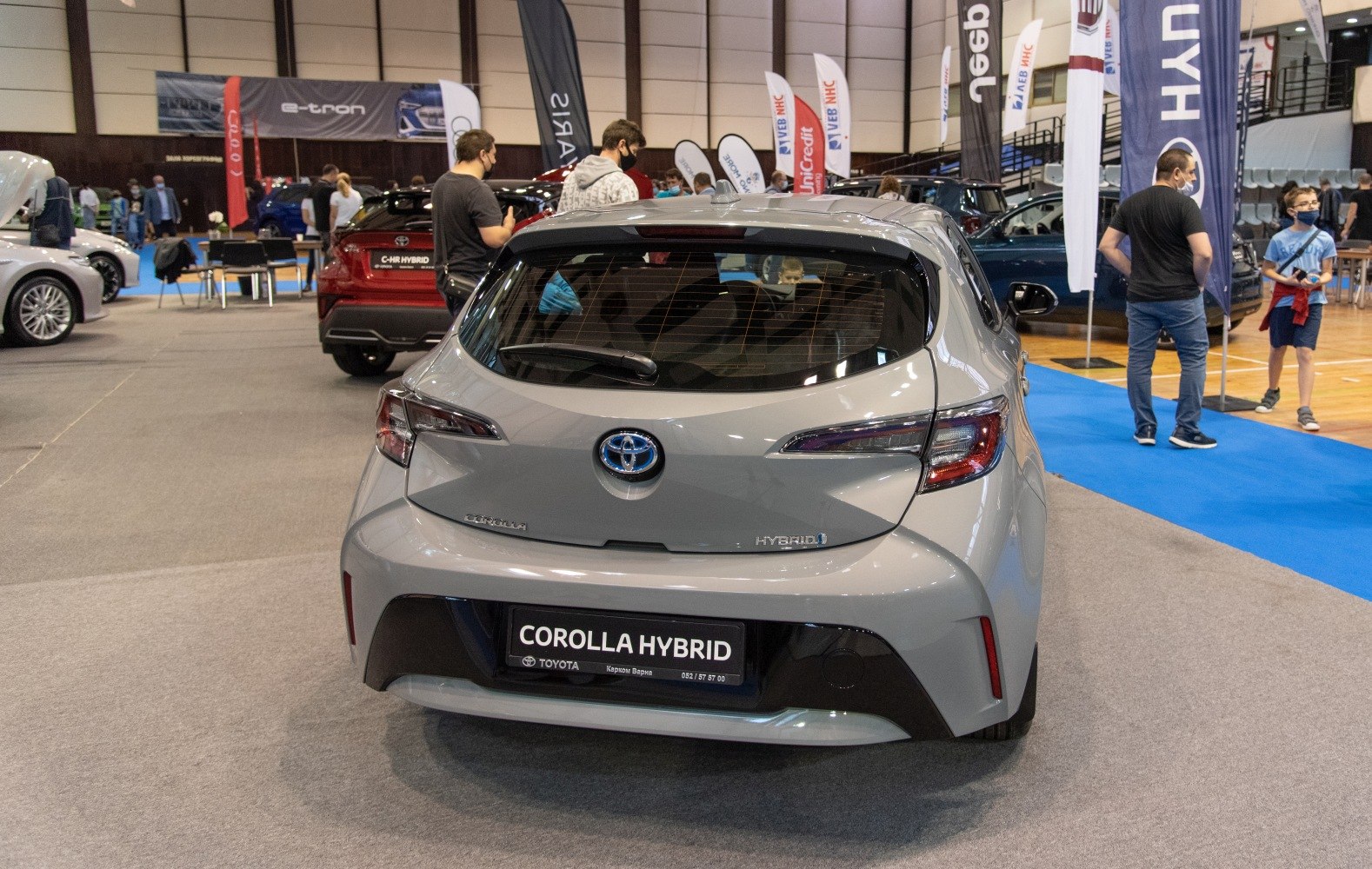 Modern hybrid hatchback rear design with distinctive tail lights