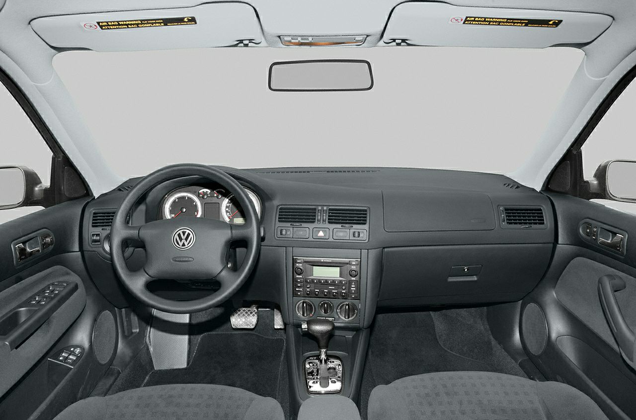 Car interior with dashboard, steering wheel, and automatic gear shift
