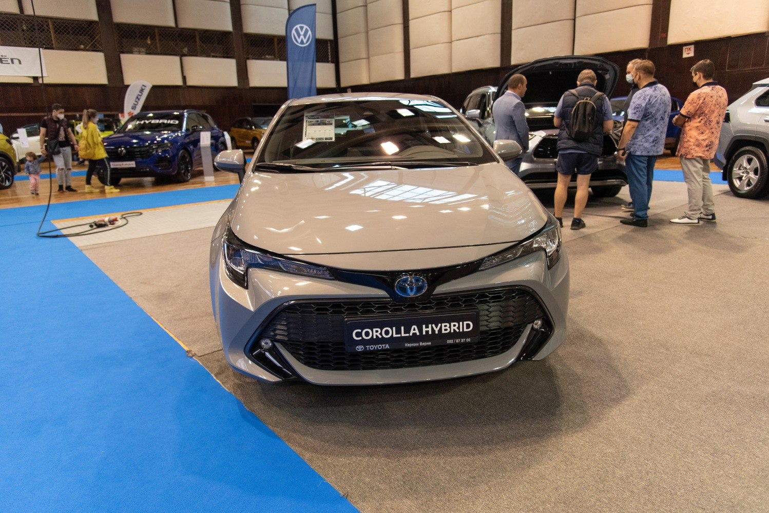 Front view showcasing sleek grille and headlights of hybrid vehicle