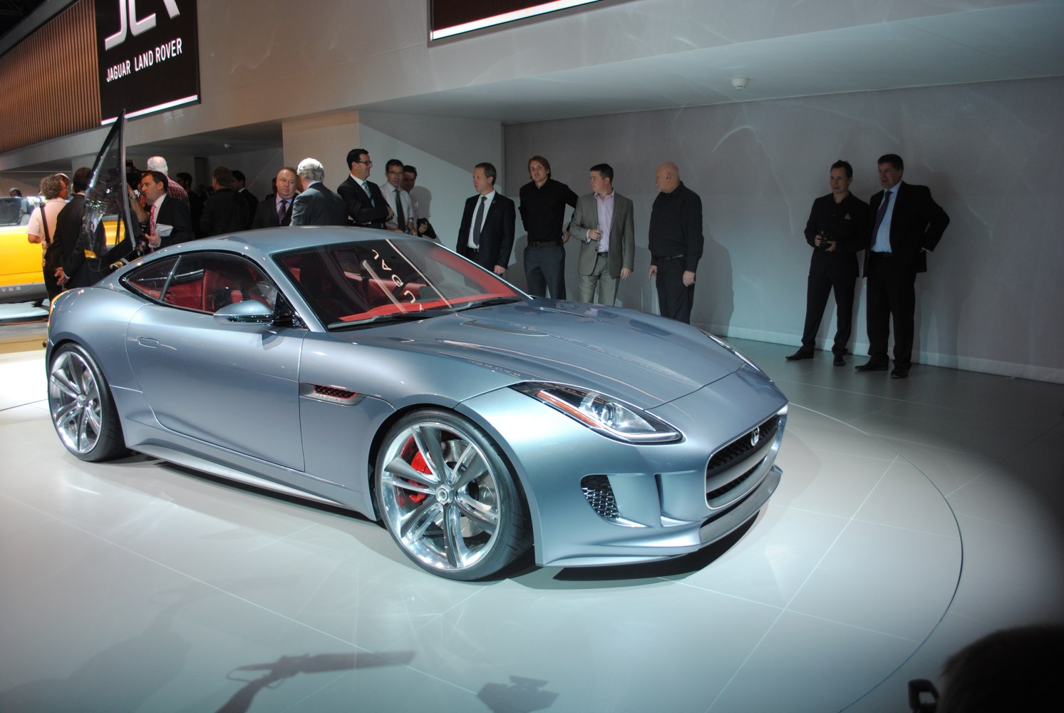 Silver sports coupe with chrome wheels and red brake calipers