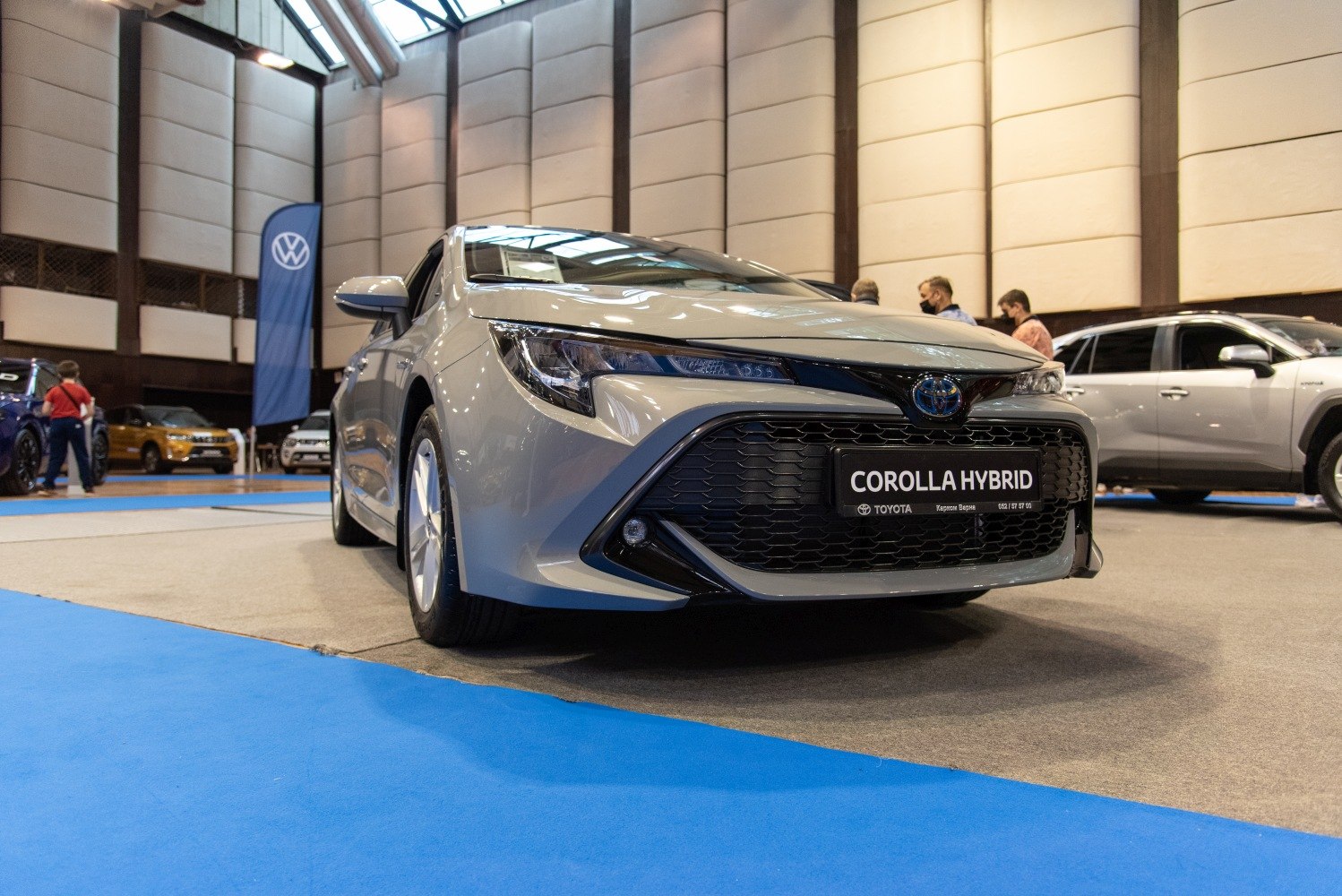 Front grille and headlights of a modern hybrid hatchback