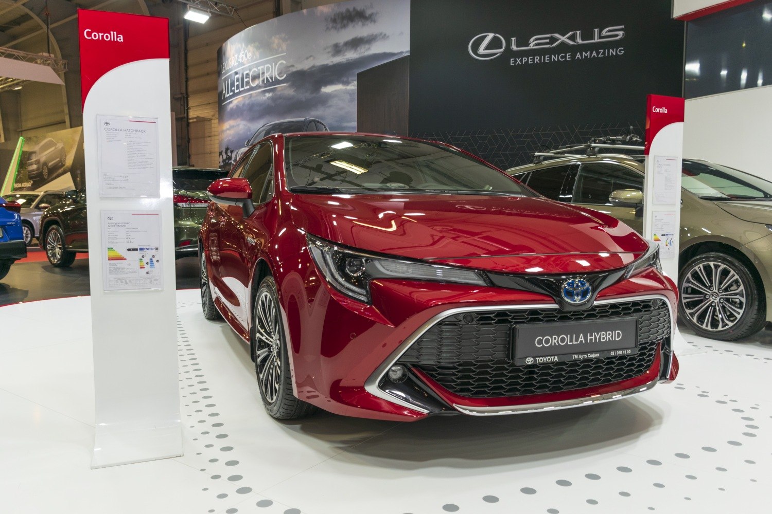 Front view of a hybrid sedan with sporty grille and LED headlights
