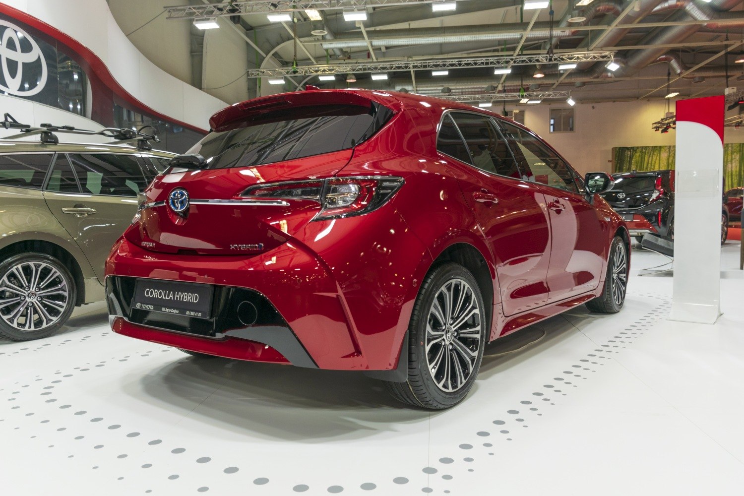 Sleek rear and side view with taillights and alloy wheels