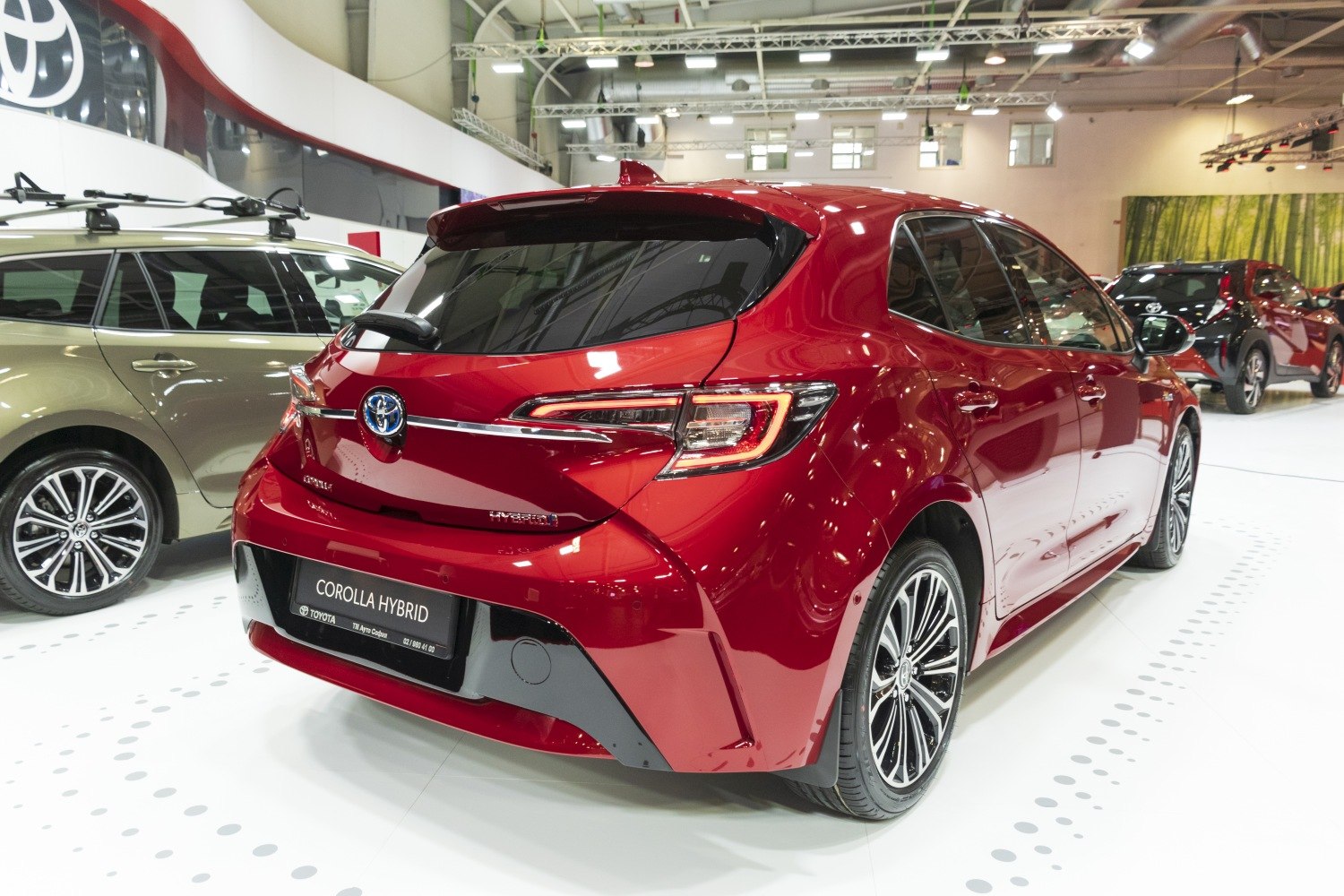 Rear hatchback view with hybrid badge and distinct LED tail lights
