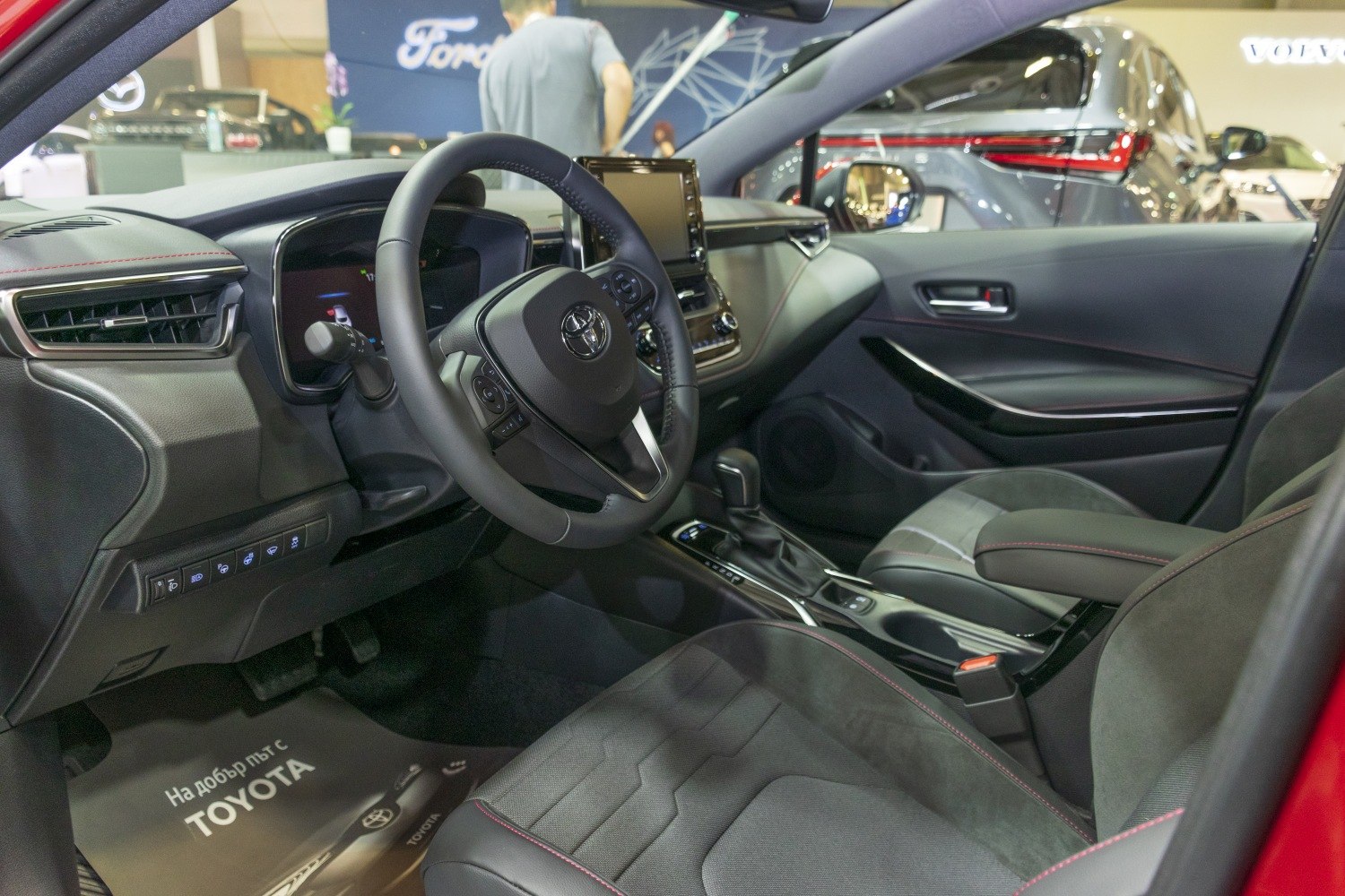 Modern car interior with steering wheel and infotainment display