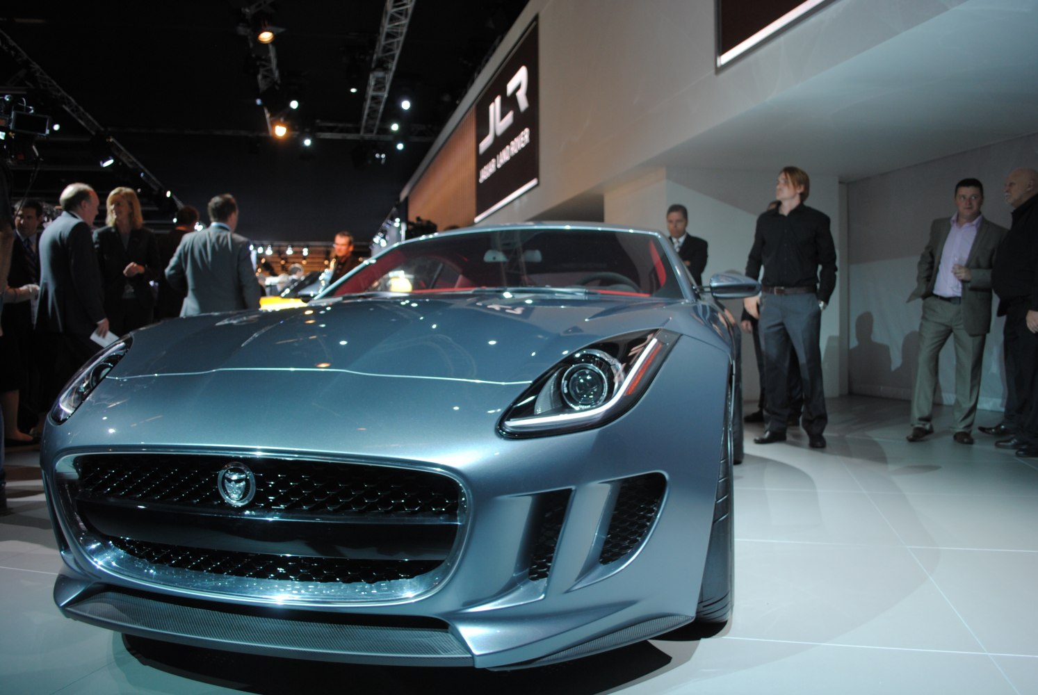 Close-up front view of sleek sports car with distinctive grille and headlights.
