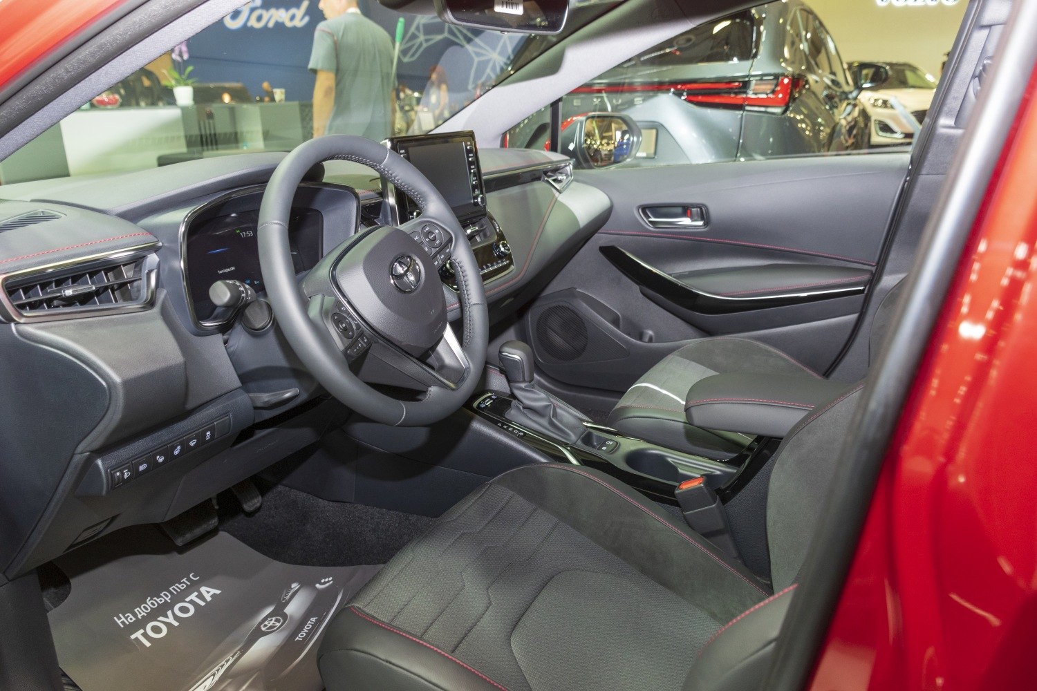 Dashboard and ergonomic front seats with steering wheel and touchscreen display