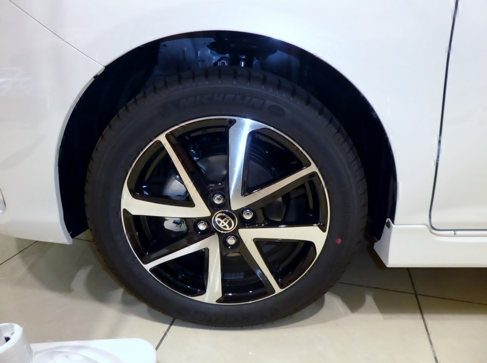 Black and silver alloy wheel with visible tire and suspension
