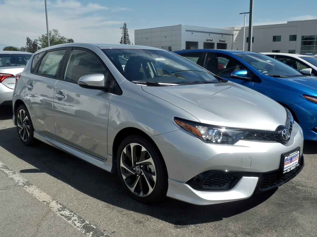 Silver hatchback with sporty grille and sleek headlights