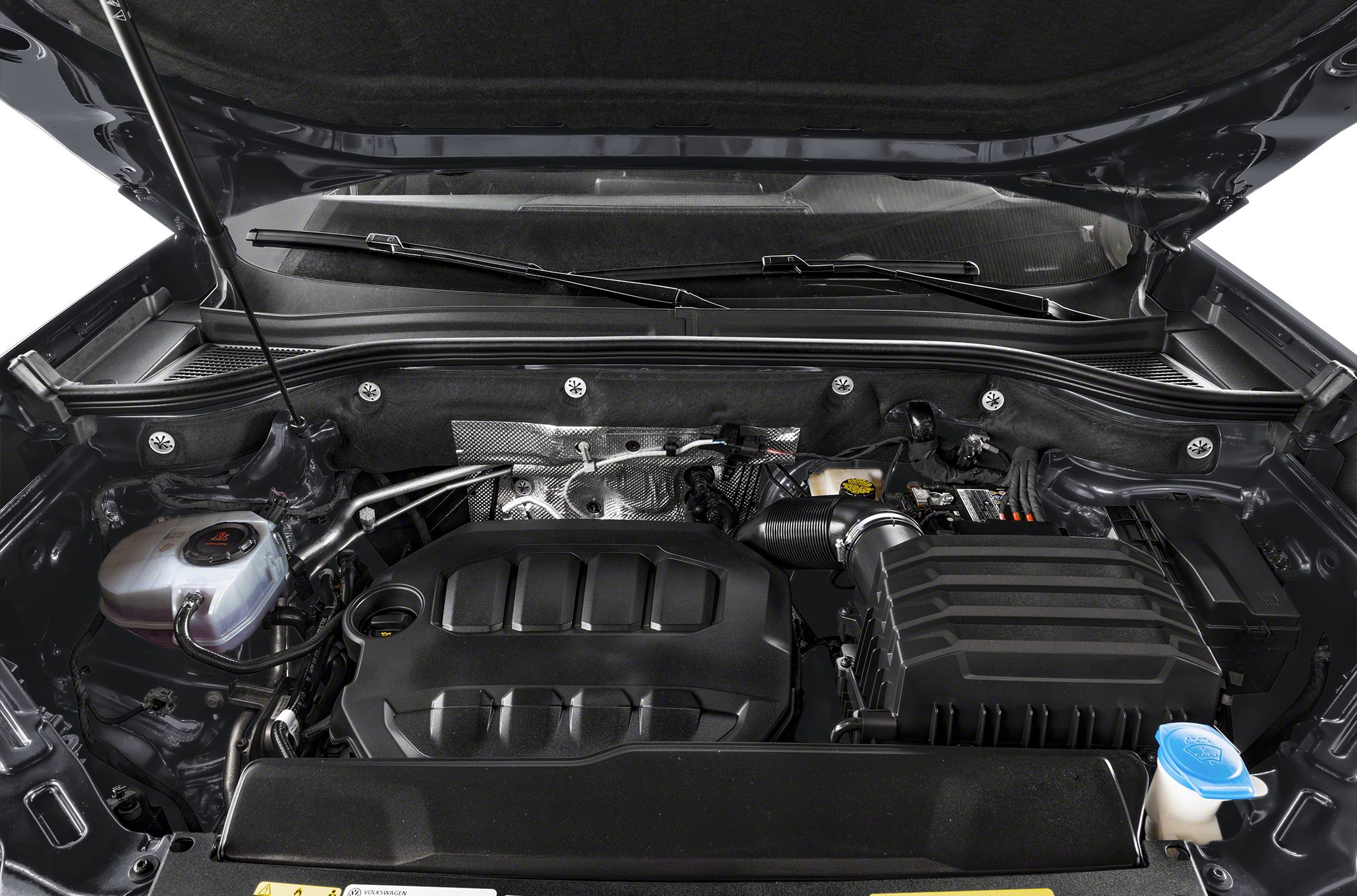 Close-up of engine bay with visible engine cover and air intake system
