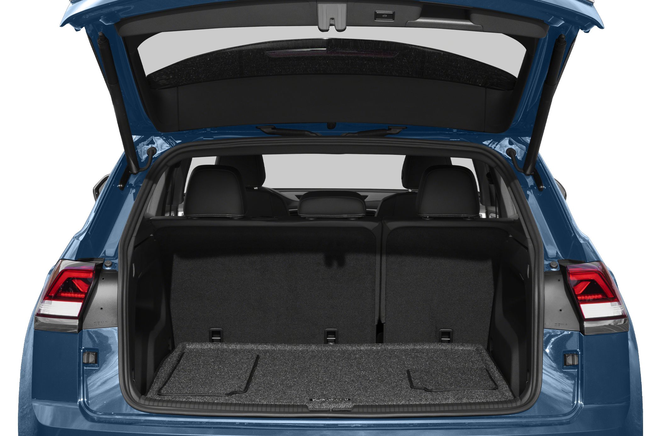 Open rear trunk cargo area with visible rear seats and storage mat